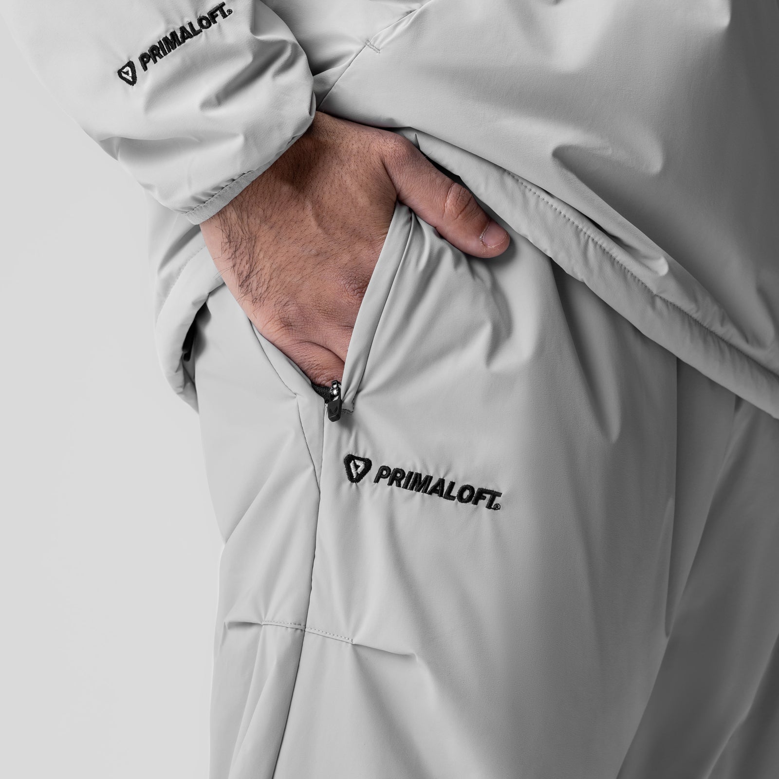 Aerotex™ PrimaLoft® Warm-Up Pant in slate grey, worn by model with hand in pocket