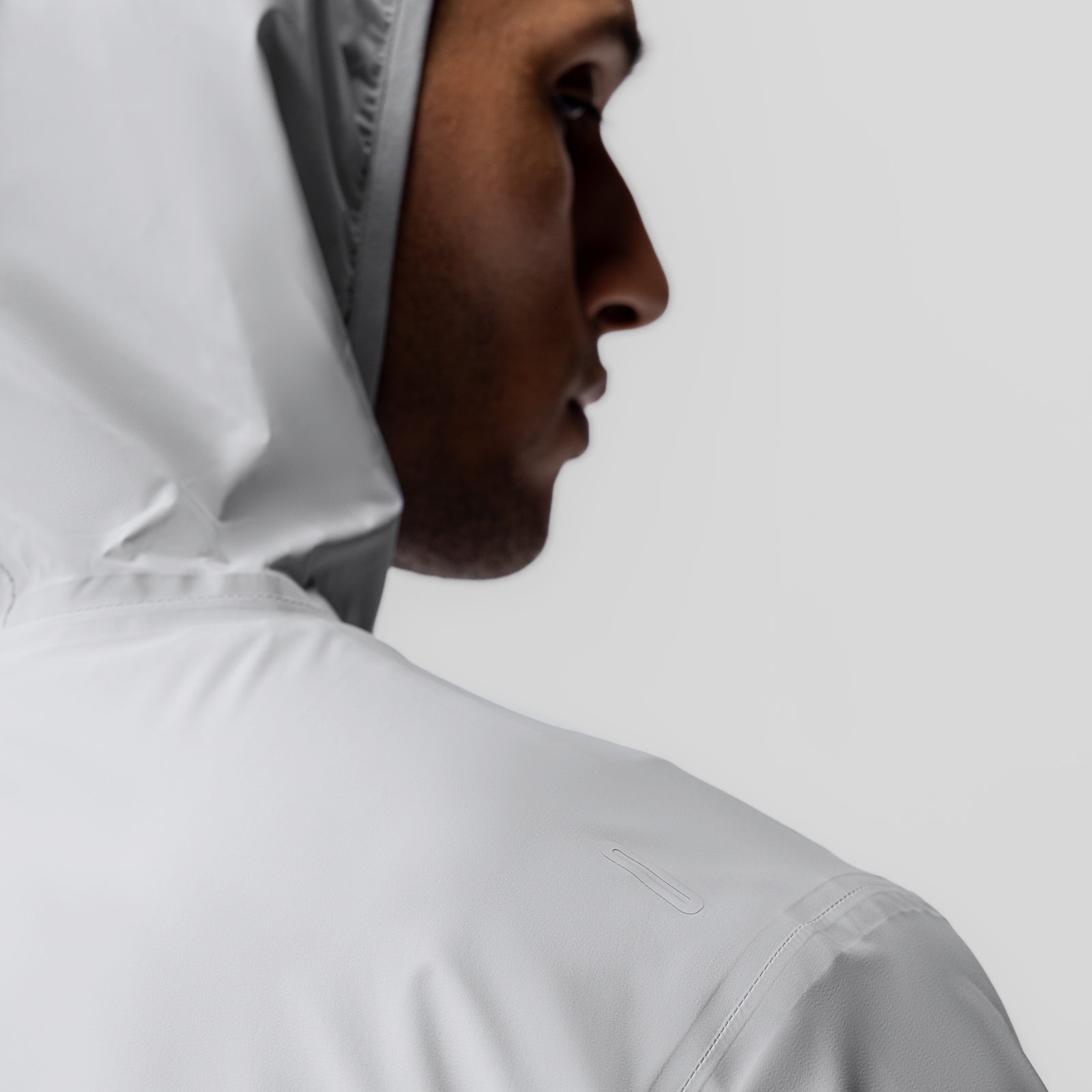 Aerotex™ Lightweight Windbreaker in slate grey, worn by model in profile view