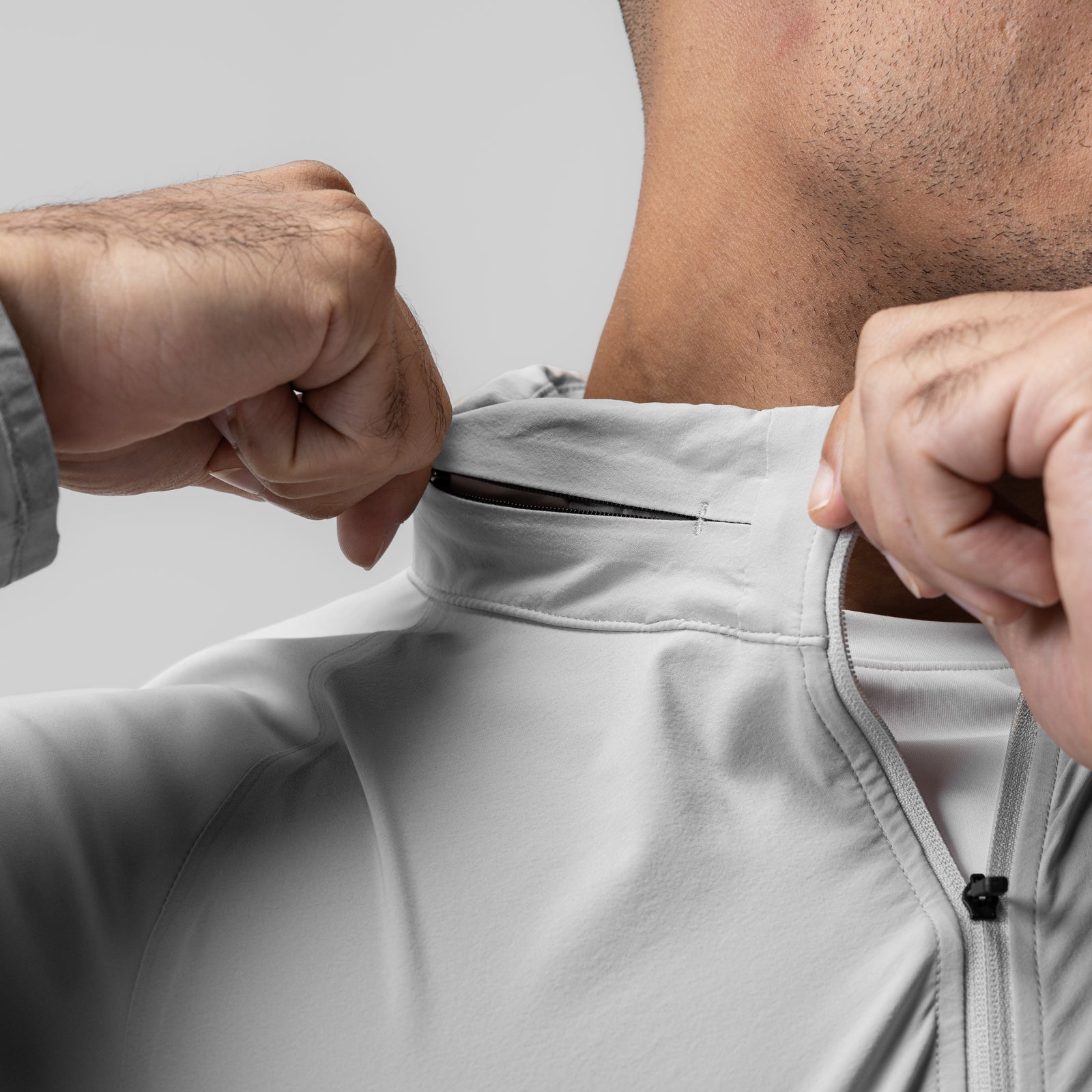 Aerotex™ Weather-Ready Bonded Windbreaker in slate grey, model wearing and displaying zipper detail