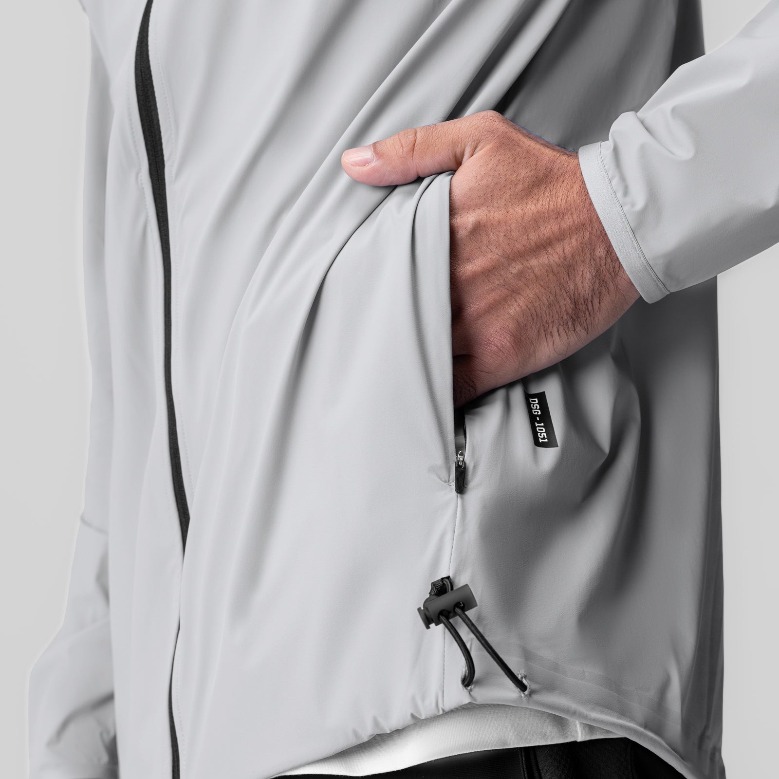 Aerotex Lightweight Windbreaker in slate grey, worn by model showing zipper detail