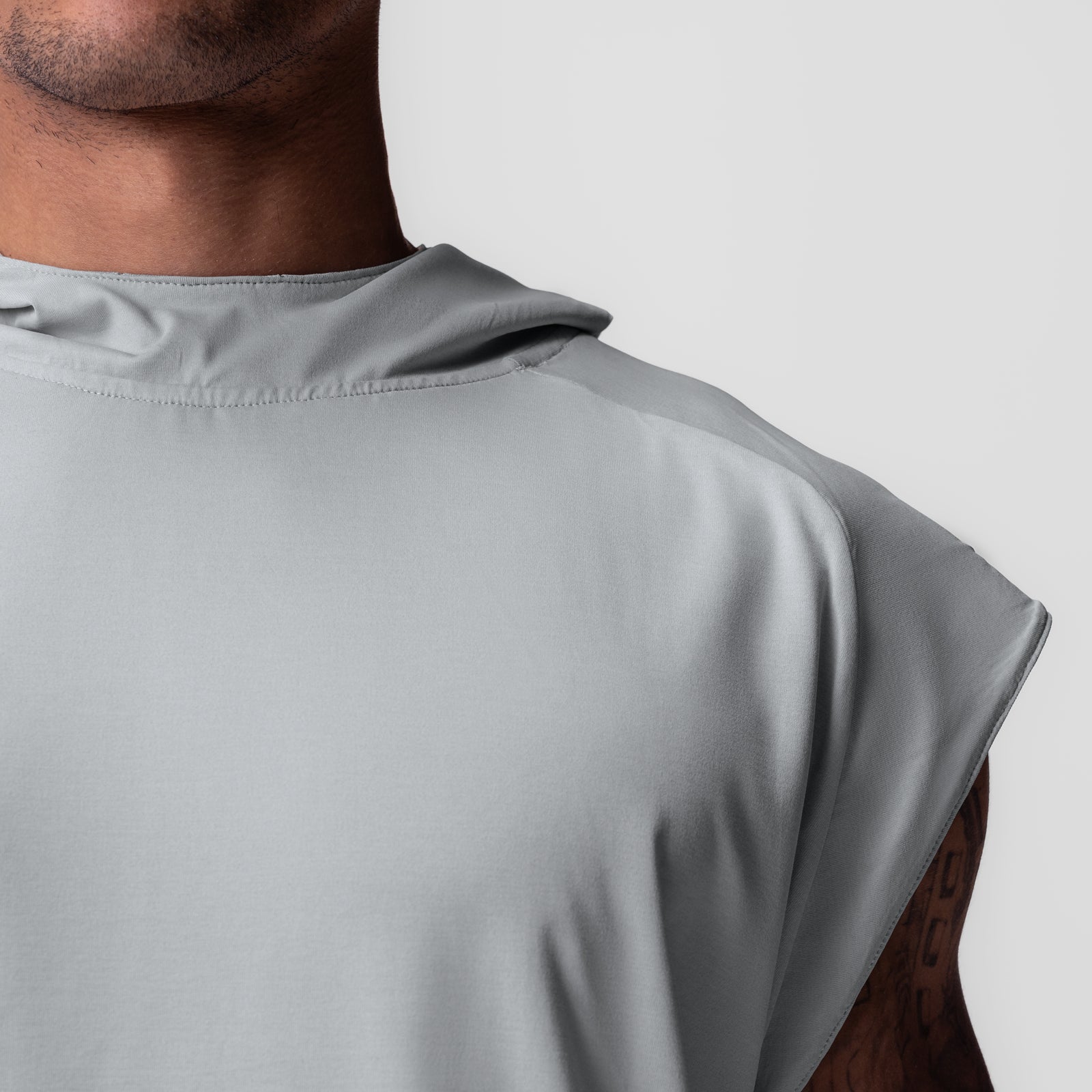 Reversible 2-in-1 Cutoff Hoodie in slate grey worn by model, back shoulder view