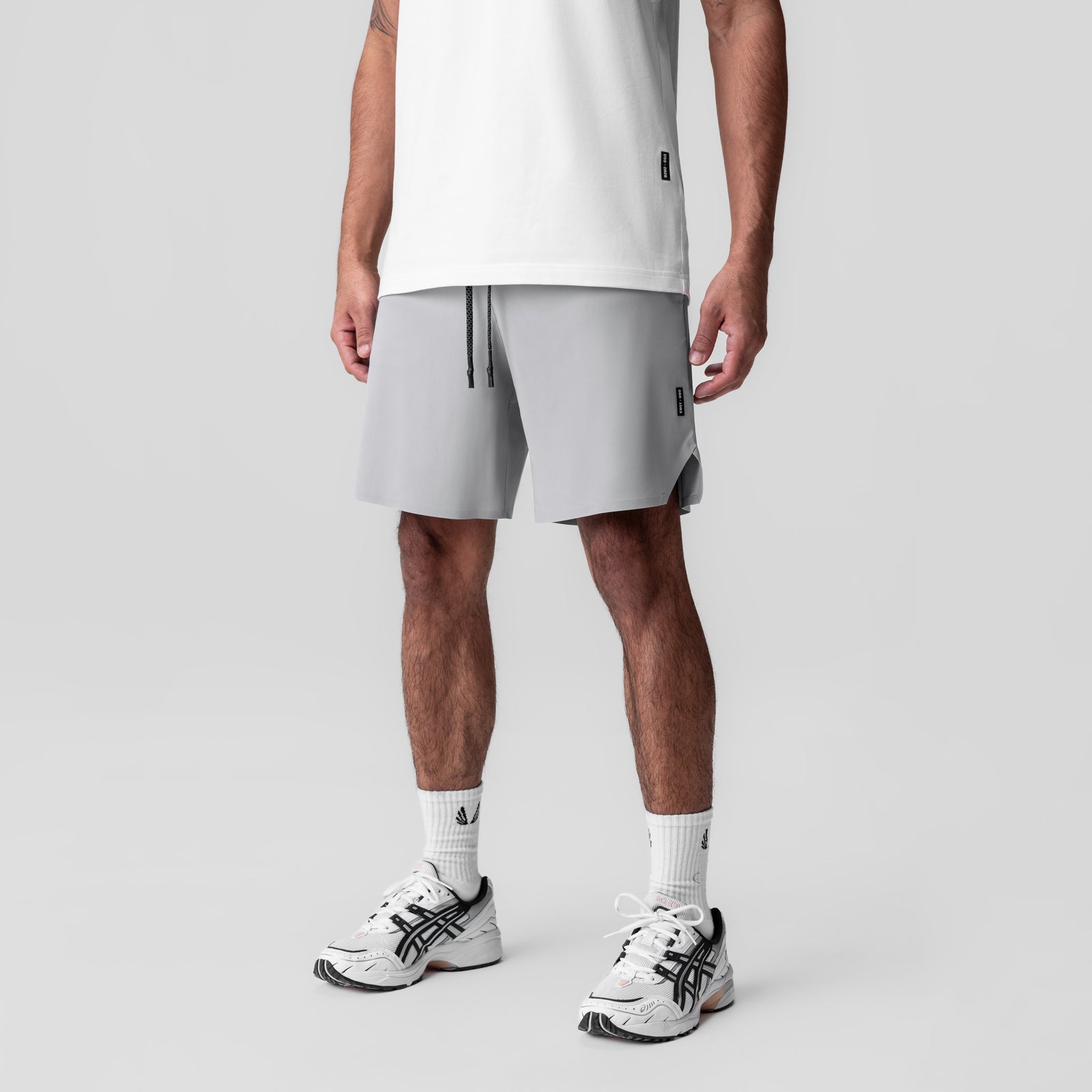 Revolutional Field Short in slate grey, worn by model with white tee and white sneakers