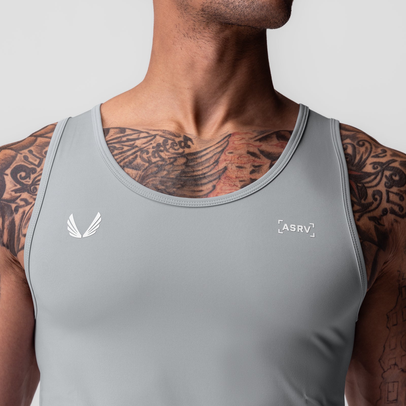 WarpFlexx-Lite® Slim Tank in slate grey worn by male model, front view