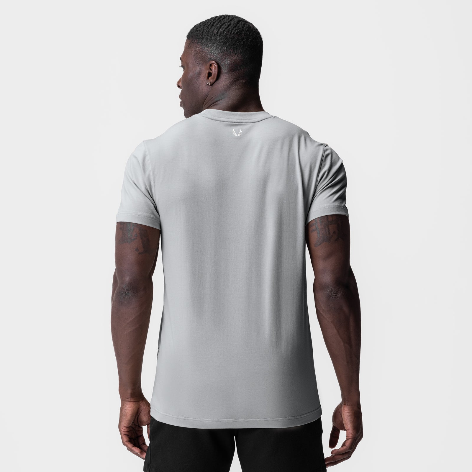 Supima Essential Tee in slate grey worn by model, back view