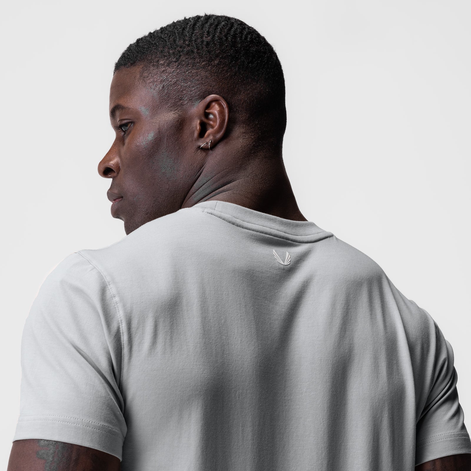 Supima Essential Tee in Slate Grey, worn by model shown from behind