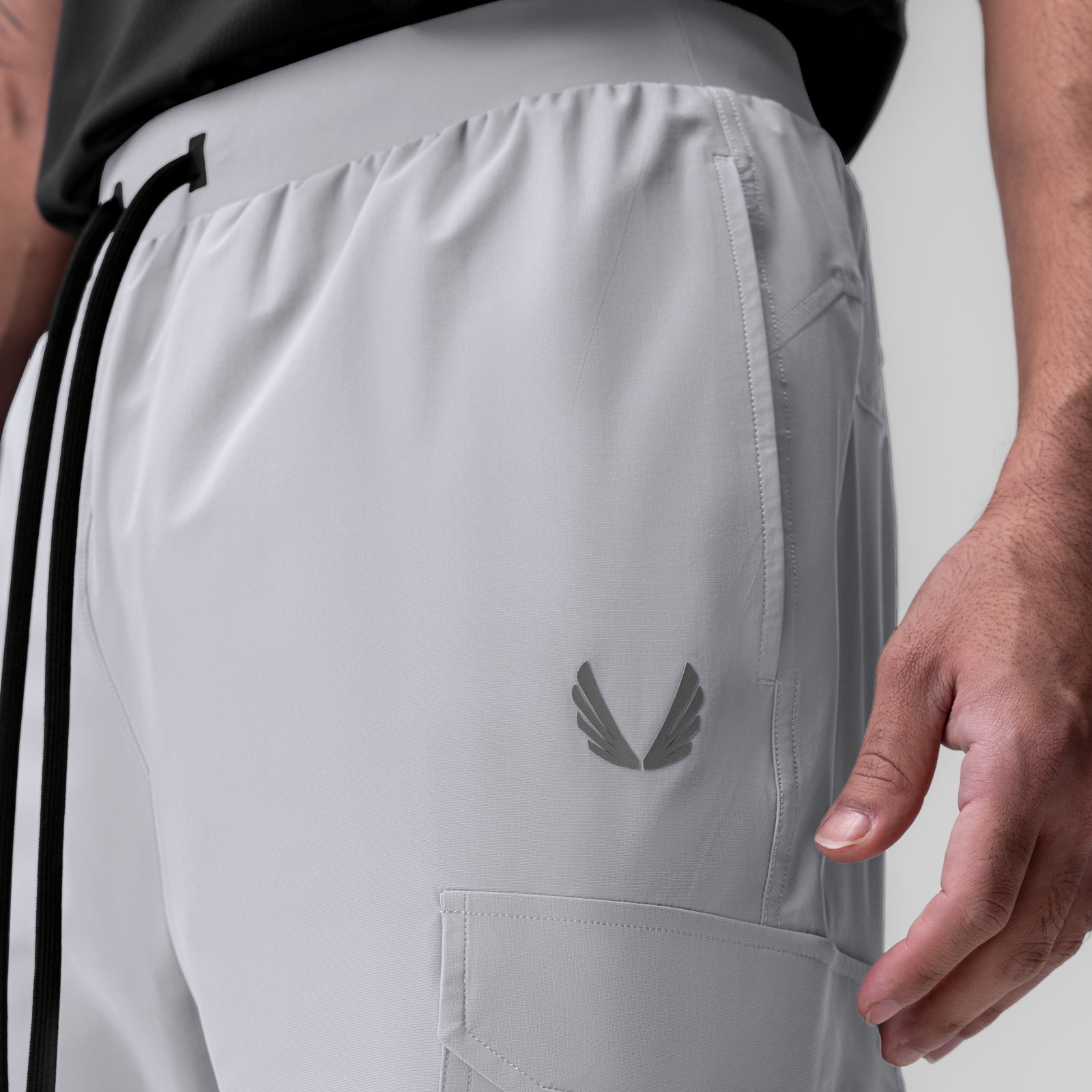 Tetra-Lite Ice Cargo High Rib Jogger in white, worn with side pocket detail visible