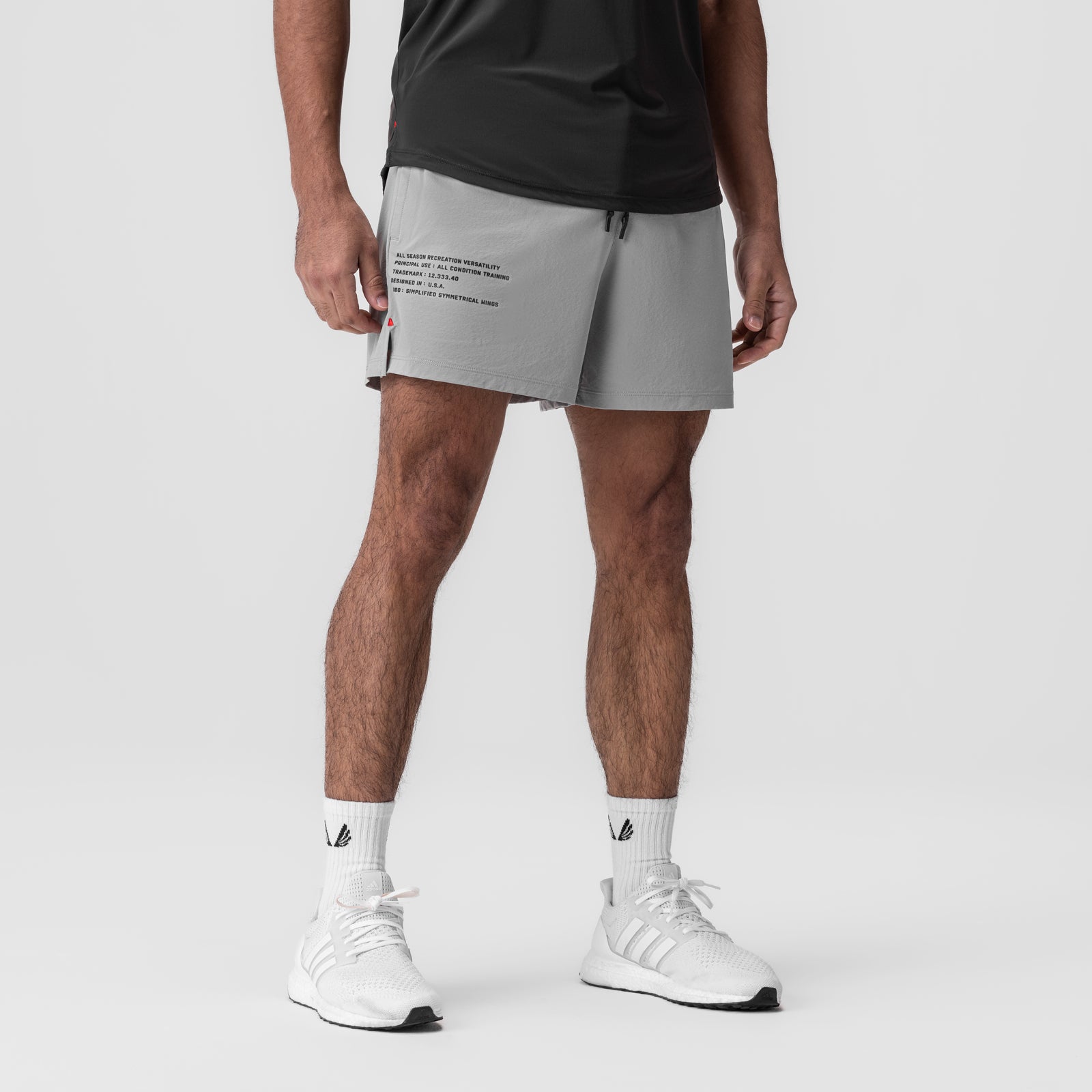 Aerotex Training Short in slate grey, worn by model with white sneakers and socks