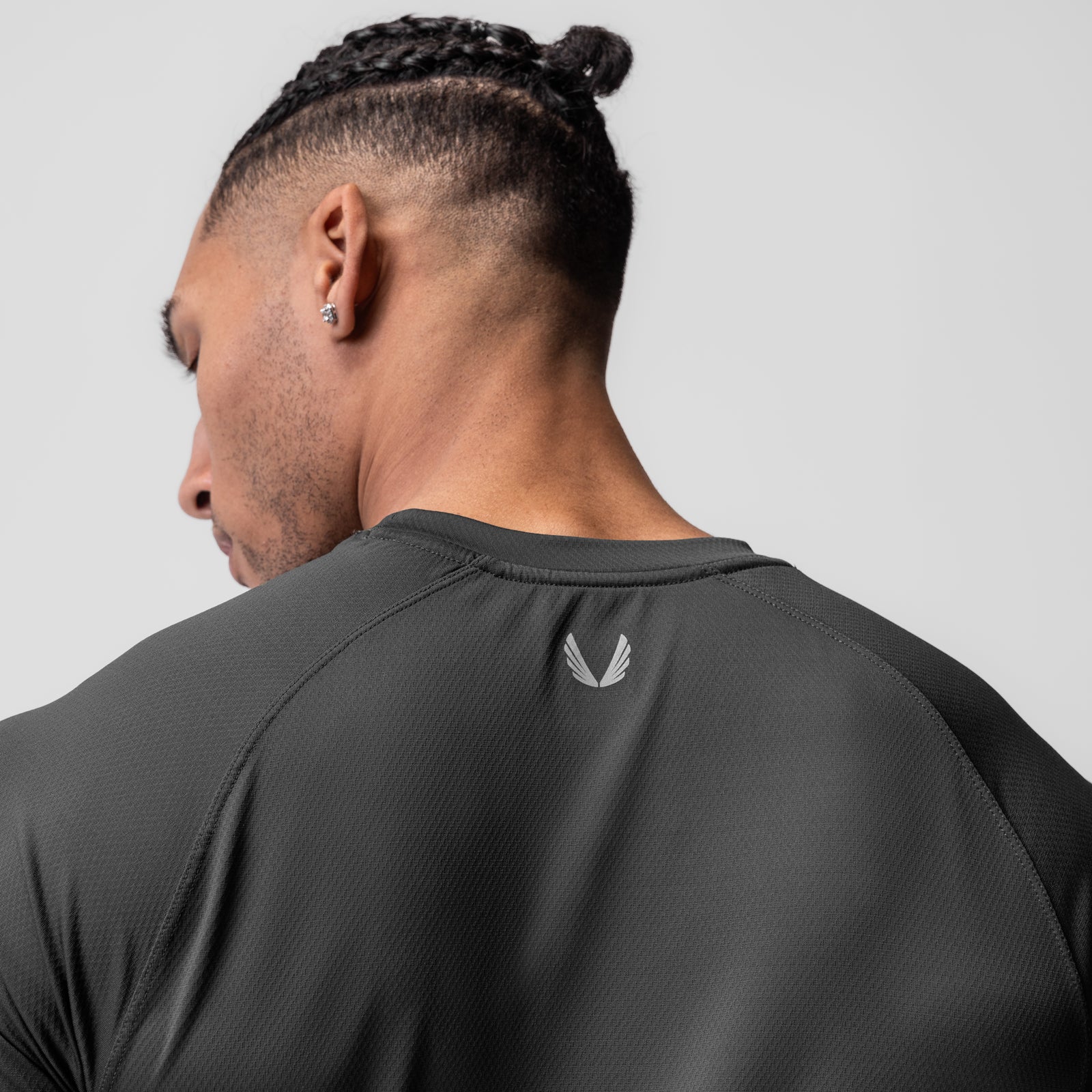 AeroSilver Established Tee in Space Grey, worn by model showing back view with logo detail