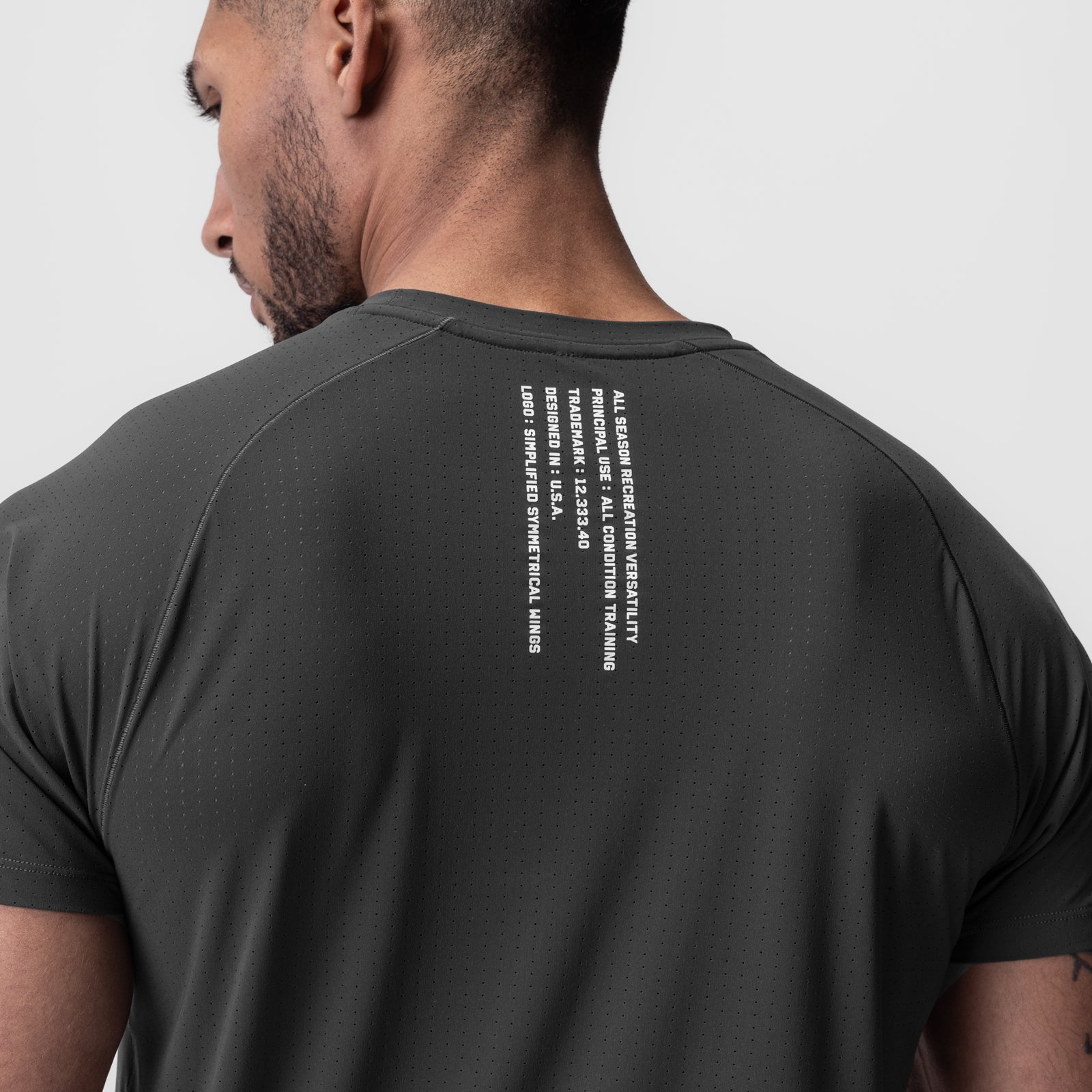Laser-Vent™ Established Tee in Space Grey, back view on model showing text detail