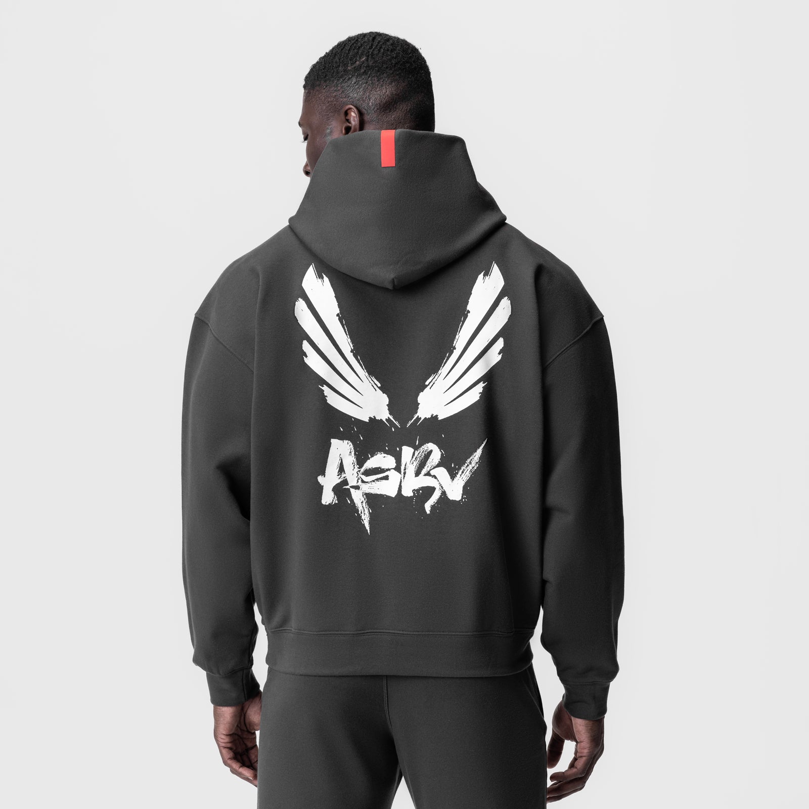 Tech-Terry™ Zip Pocket Hoodie in Space Grey with white wings graphic, back view on model