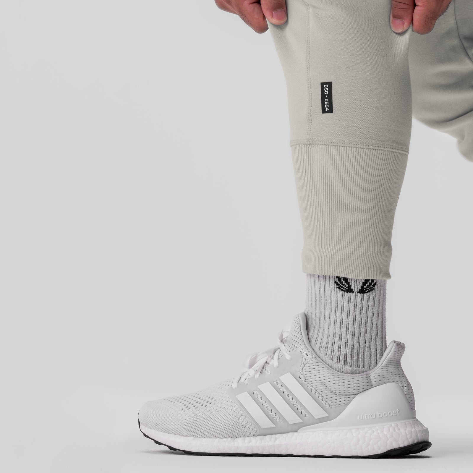 Tech-Terry Cargo High Rib Jogger in stone worn with white socks and sneakers, leg detail view