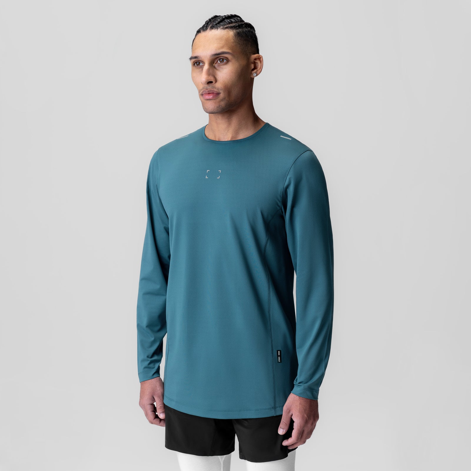AeroSilver Training Long Sleeve in teal, worn by model facing camera