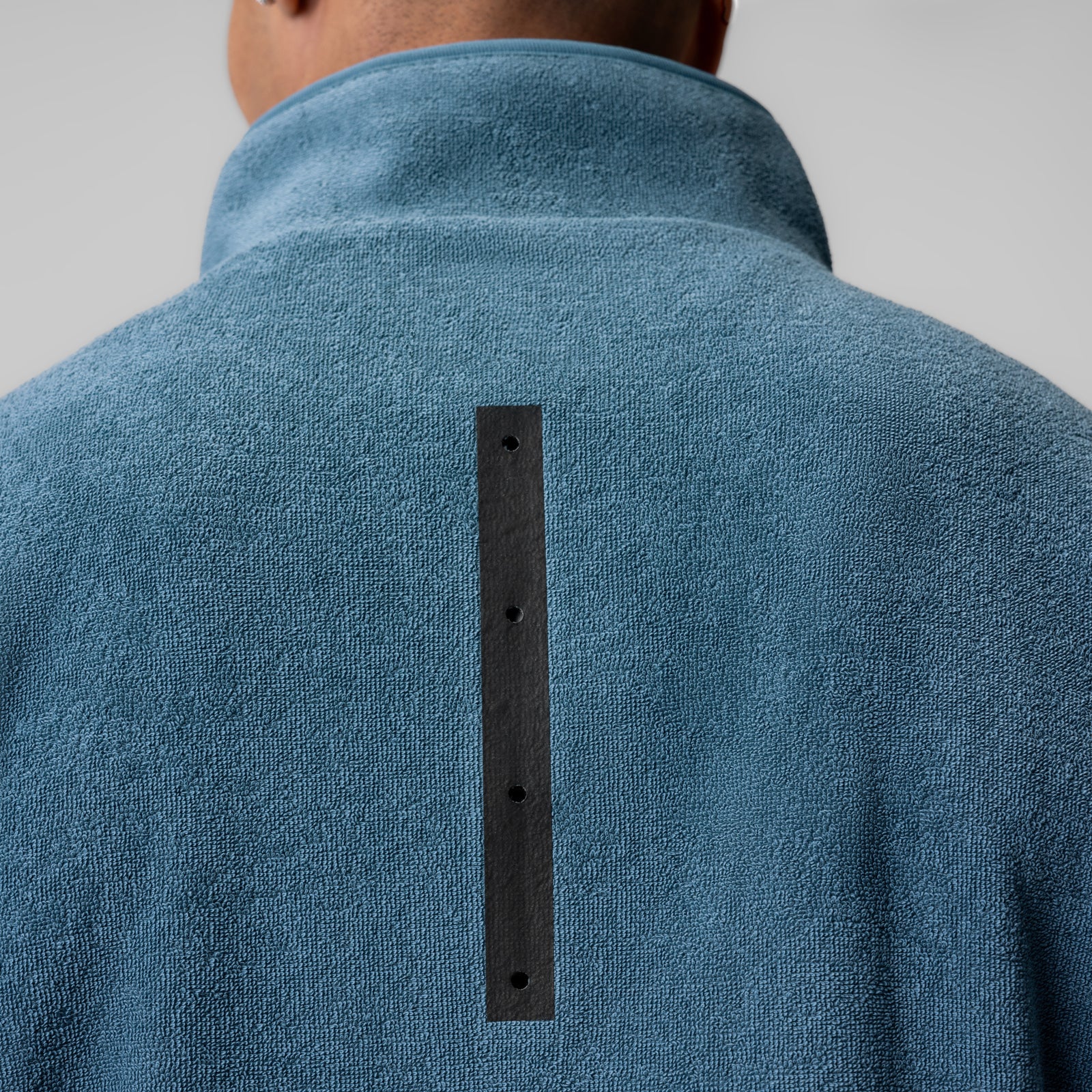 Towel Terry Quarter Zip Oversized Tee in storm blue, back view on model showing black zipper detail