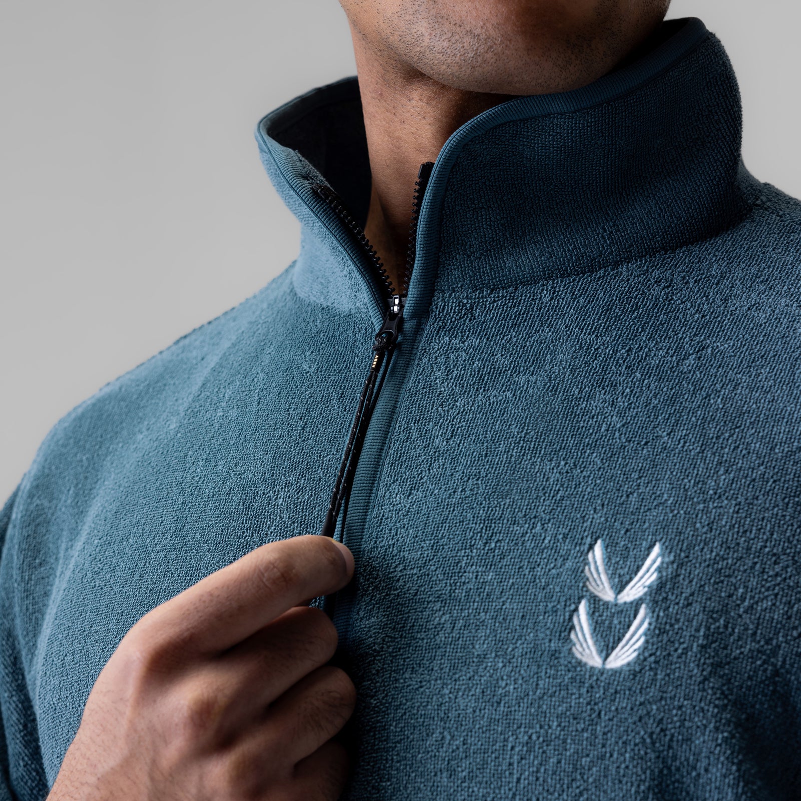 Towel Terry Quarter Zip Oversized Tee in storm blue, modeled with close-up of chest and zipper detail