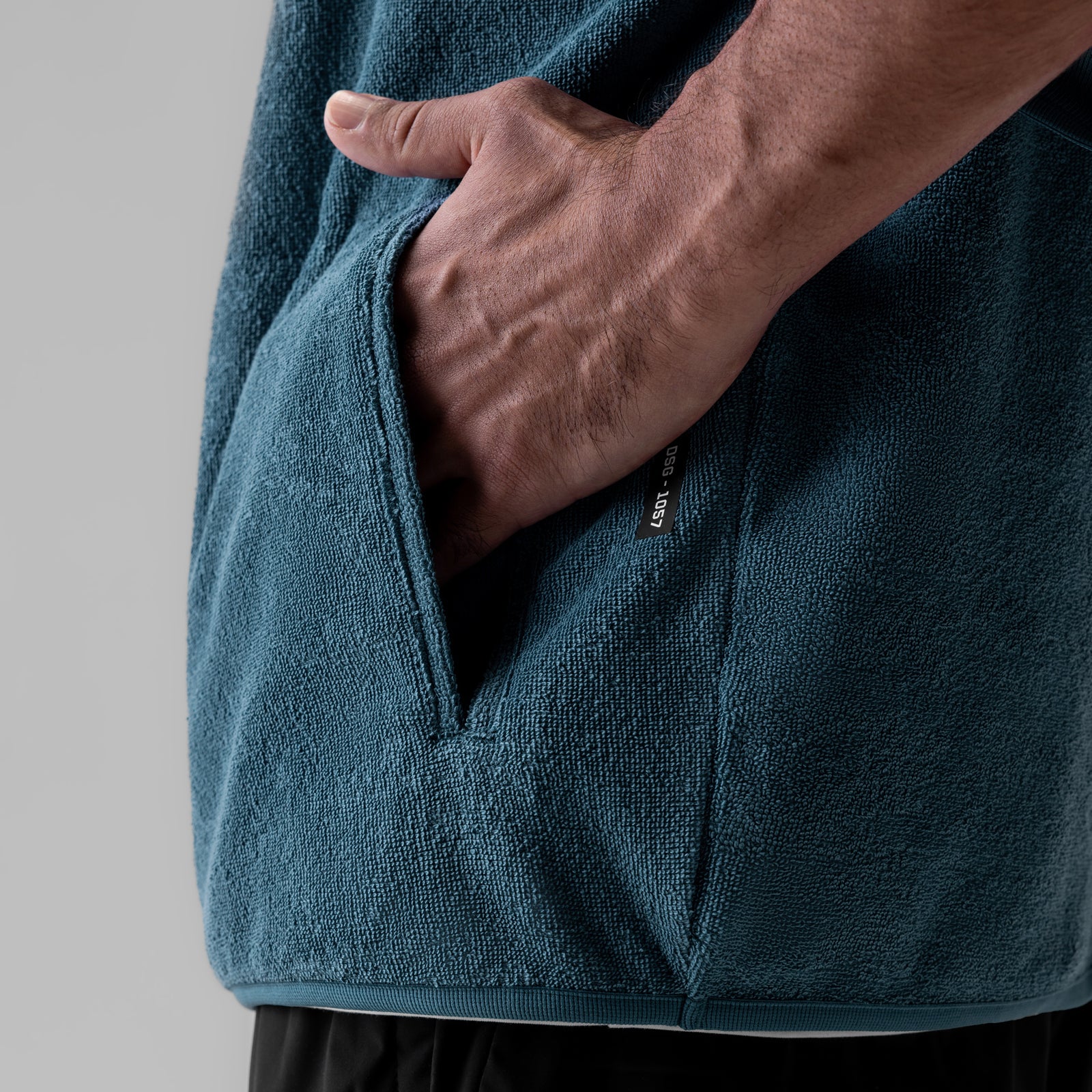 Towel Terry Quarter Zip Oversized Tee in Storm, modeled with hand in pocket