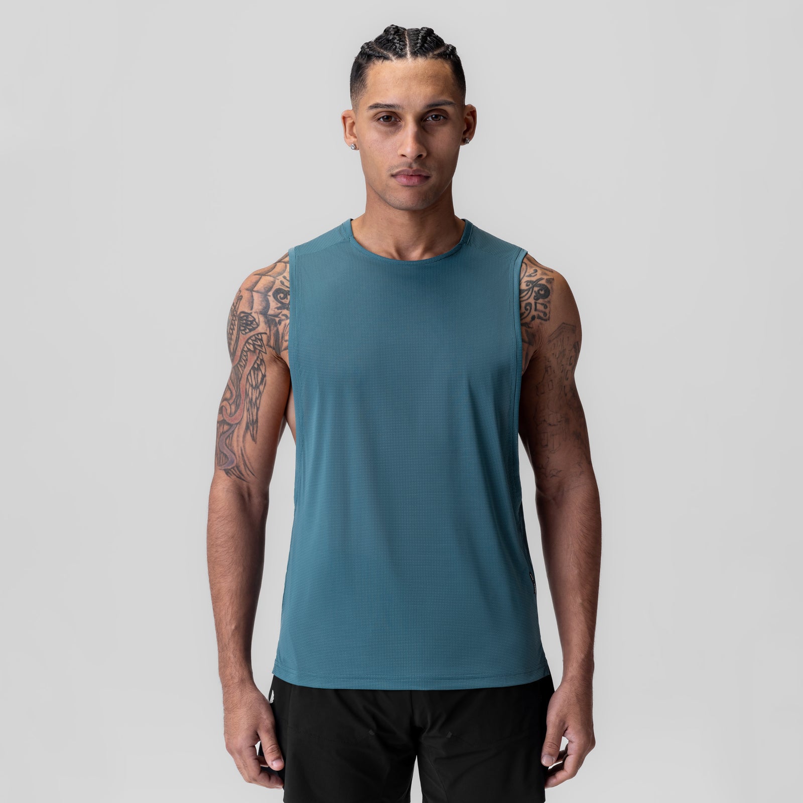 Ice-Skin™ Muscle Tank in storm blue, worn by model facing forward