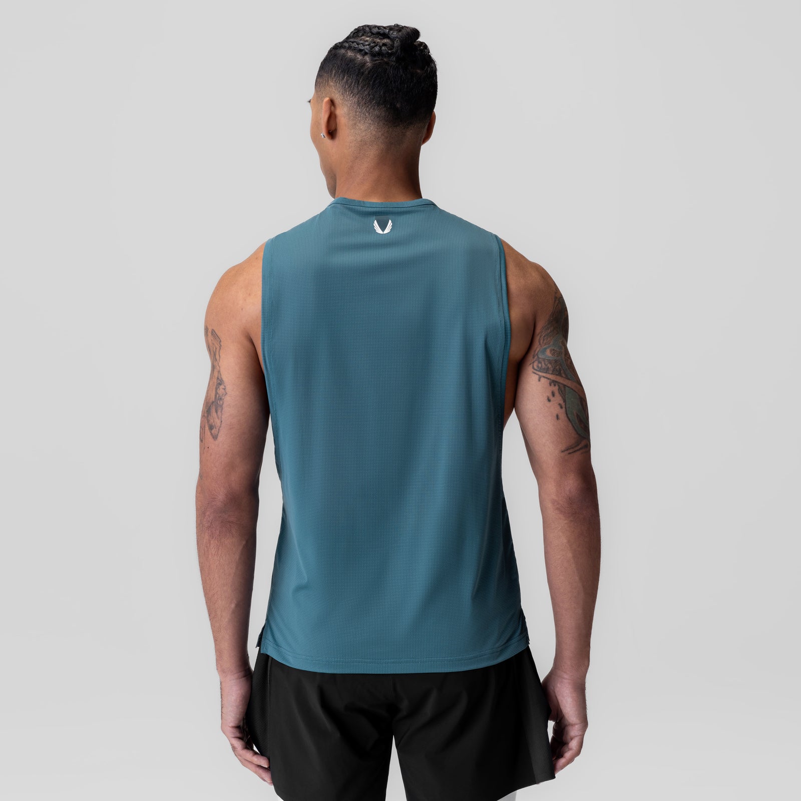 Ice-Skin™ Muscle Tank in storm blue, rear view on model