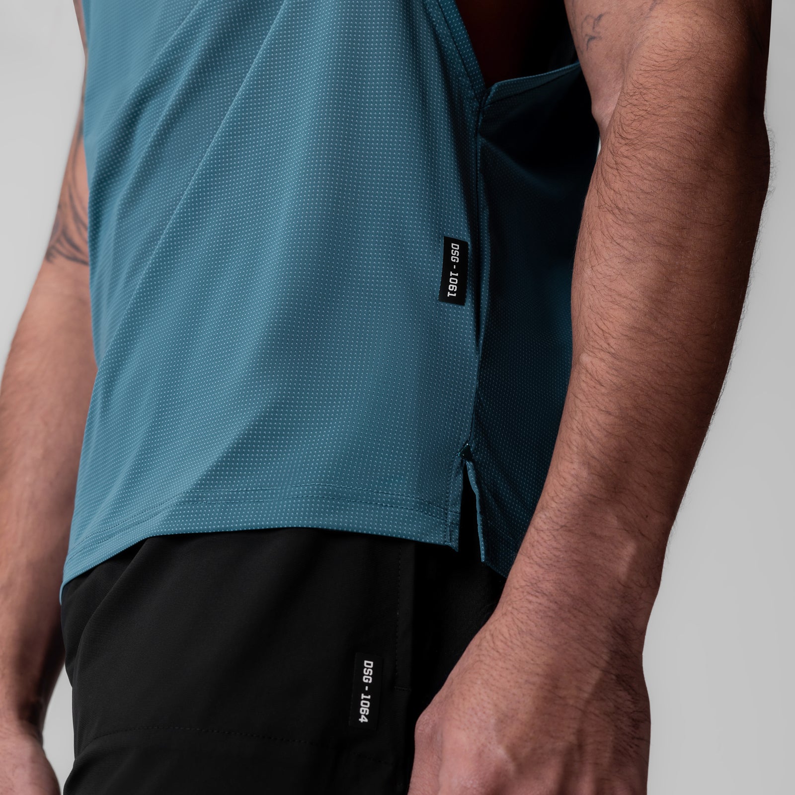 Ice-Skin Muscle Tank in storm blue, side view on model