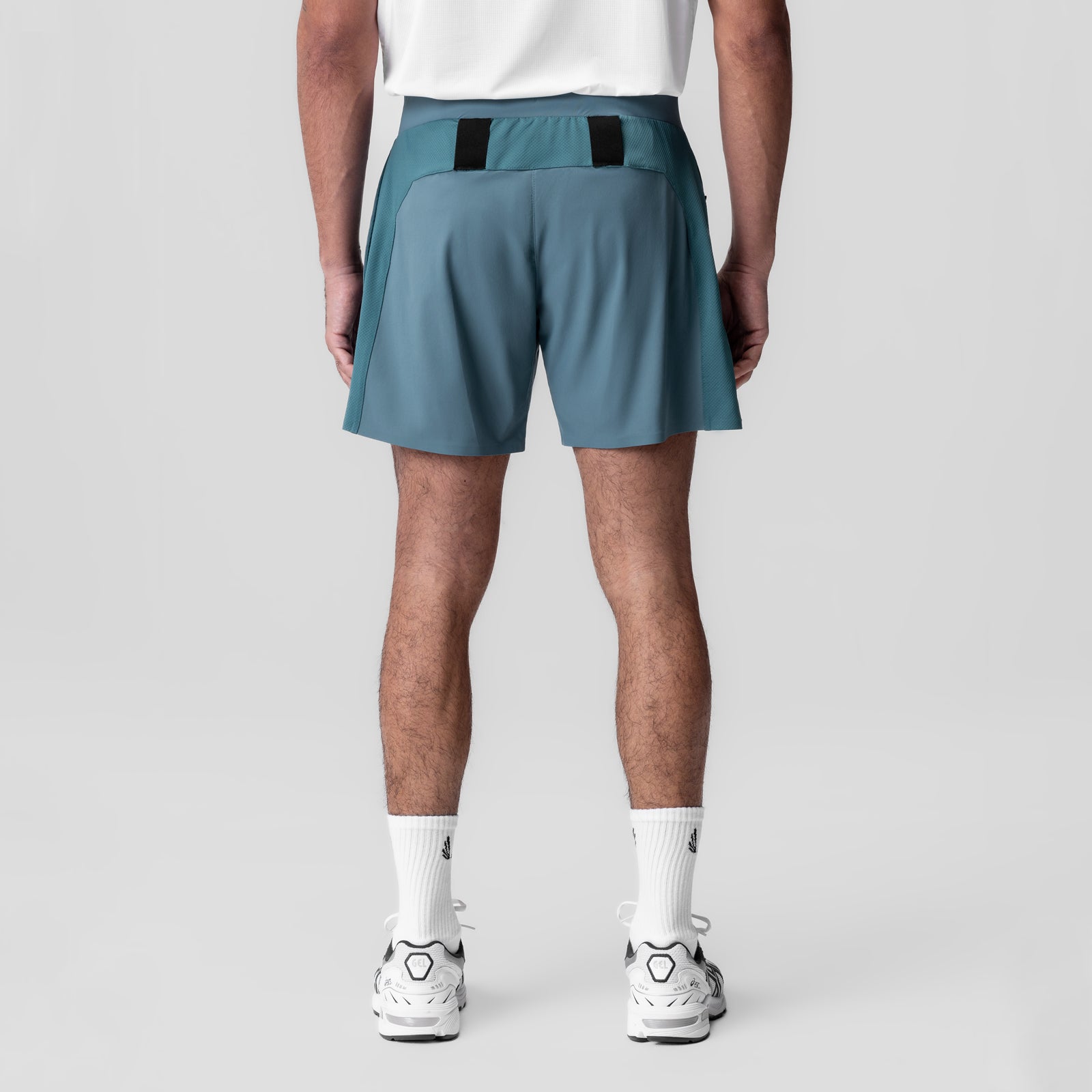 Tetra-Lite Bonded Training Short in storm blue, back view on model
