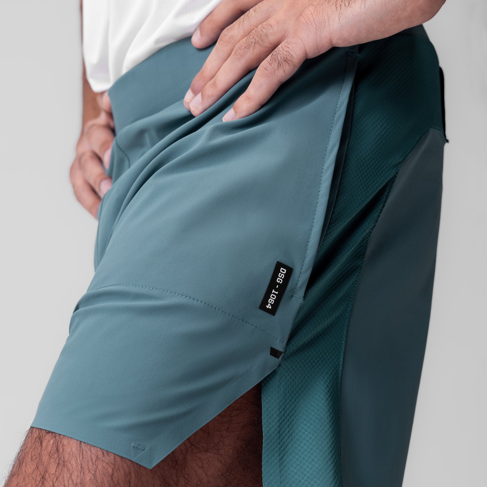 Tetra-Lite 6" Bonded Training Short in Storm, worn by model showing side pocket detail