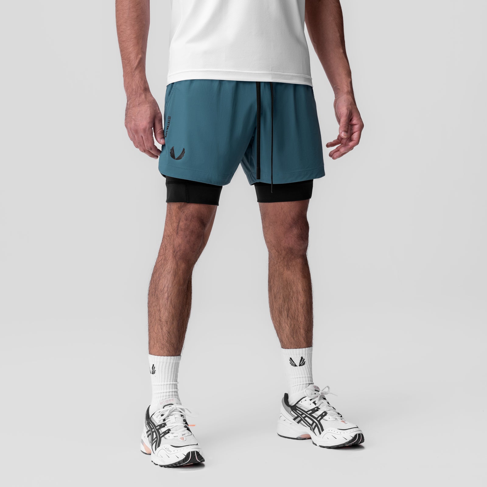 Tetra-Lite 5" Liner Short in Storm blue and black, worn with white socks and sneakers, front view