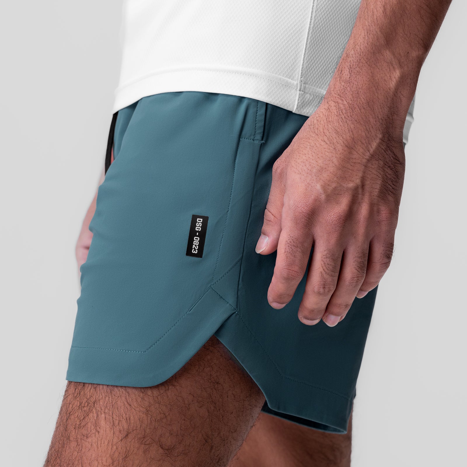 Tetra-Lite 7" Linerless Short in storm blue, worn by model, side view