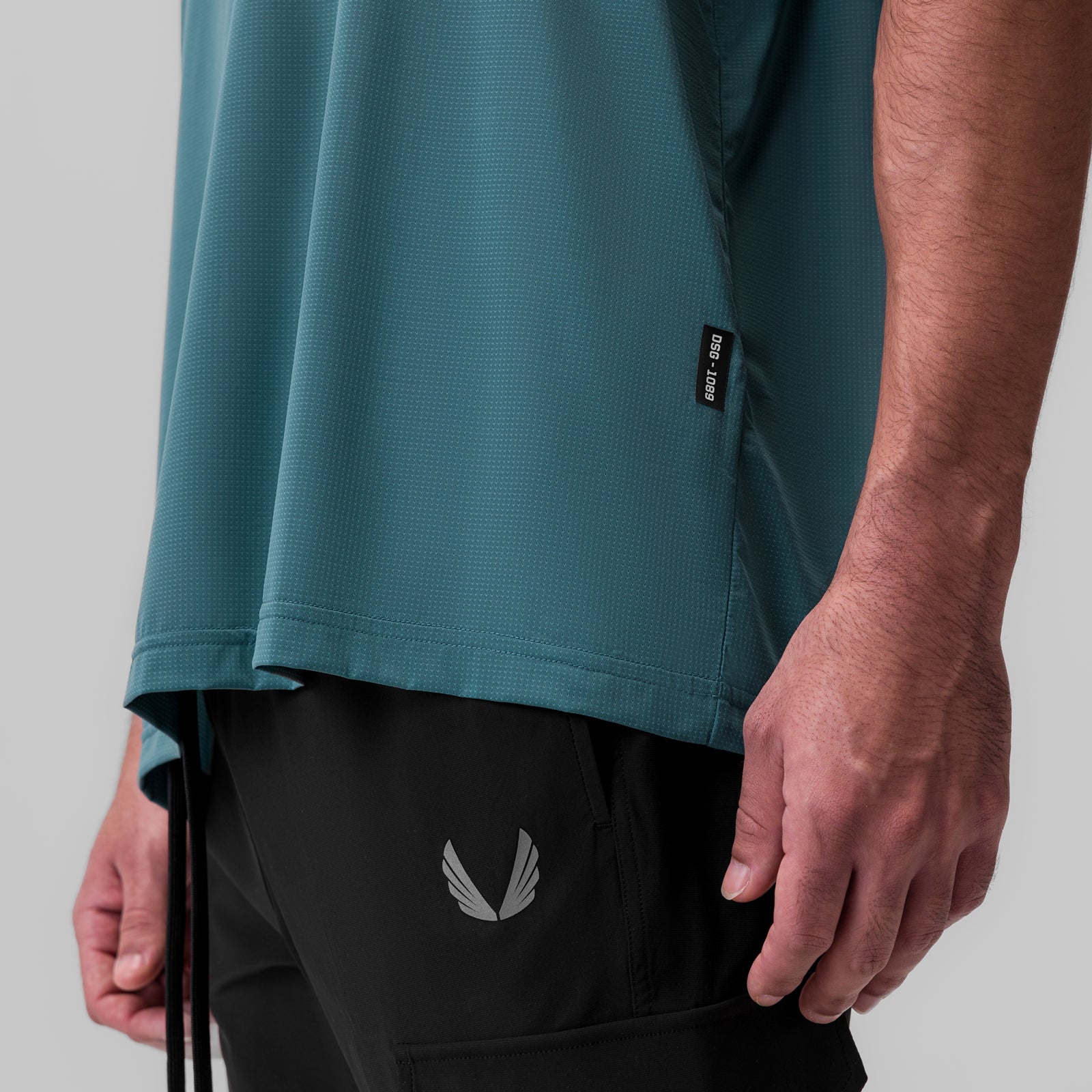 Ice-Skin Oversized Tee in storm blue worn by model, side view showing fit and fabric texture