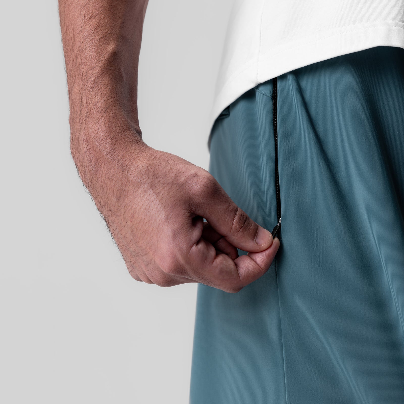 Revolutional® Field Short in storm blue, worn by model showing side seam detail