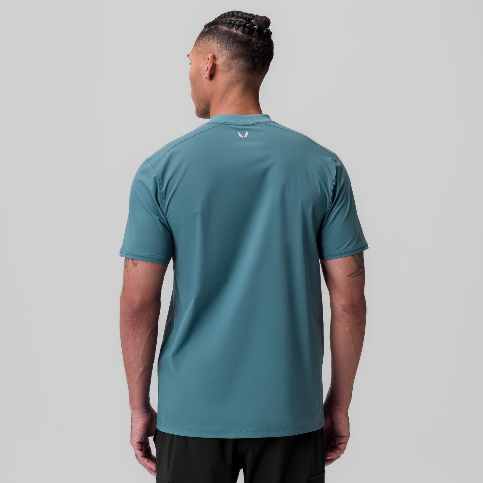 Tetra-Lite Ice Zip Tee in storm blue, rear view on model