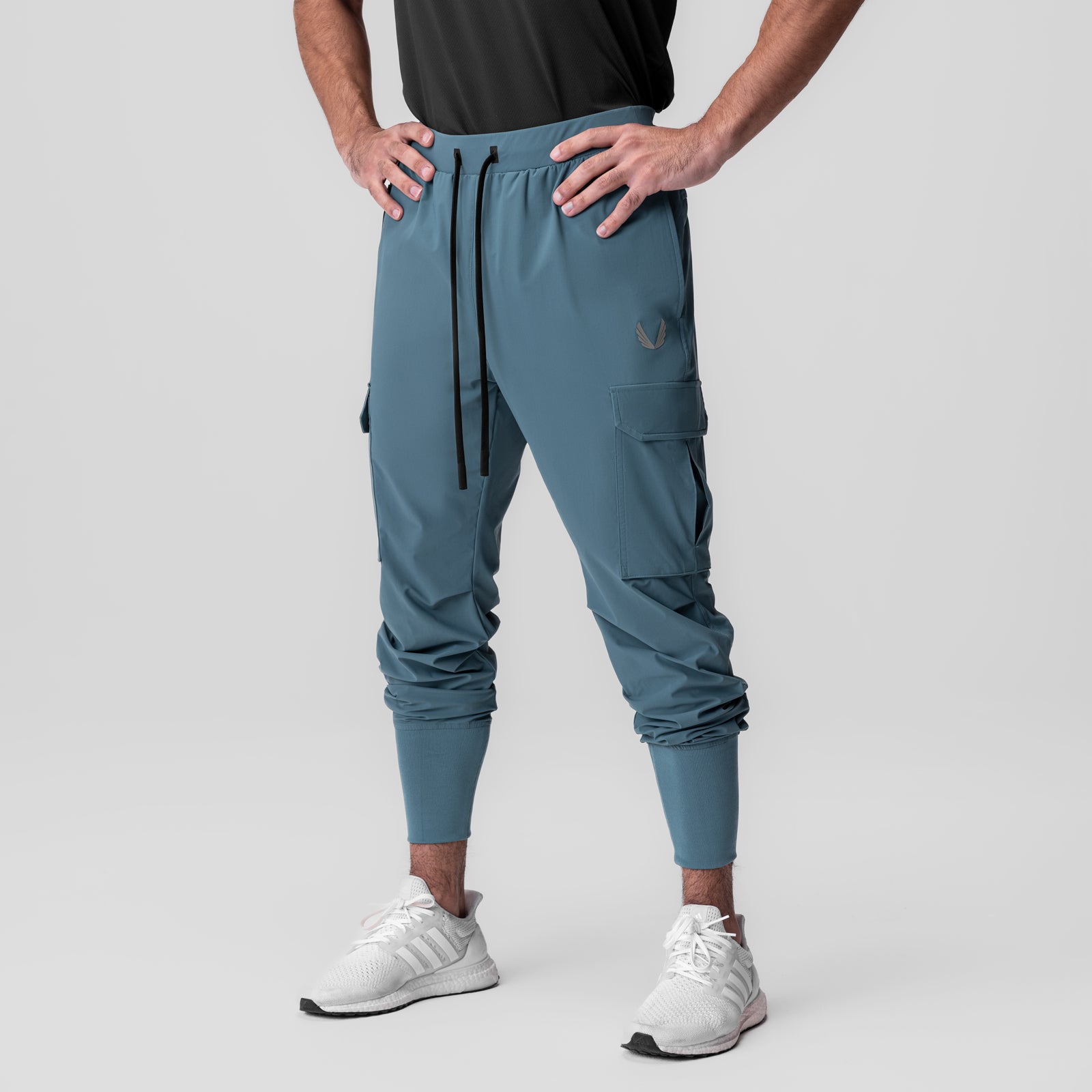 Tetra-Lite Ice Cargo High Rib Jogger in Storm blue, worn by model standing with hands on hips