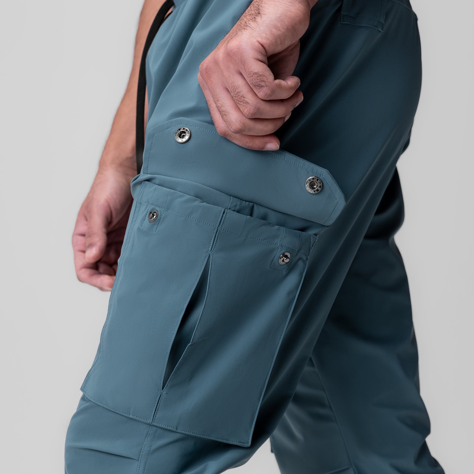 Tetra-Lite® Ice Cargo High Rib Jogger in storm blue, worn by model showing side cargo pocket detail