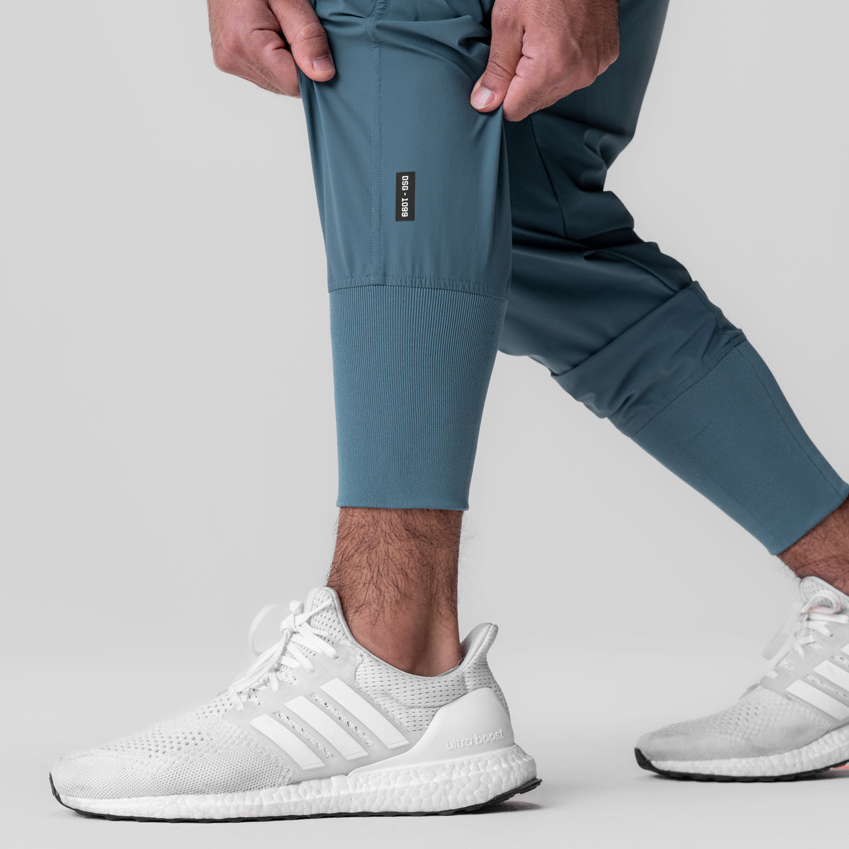 Tetra-Lite Ice Cargo High Rib Jogger in Storm blue, worn by model with white sneakers