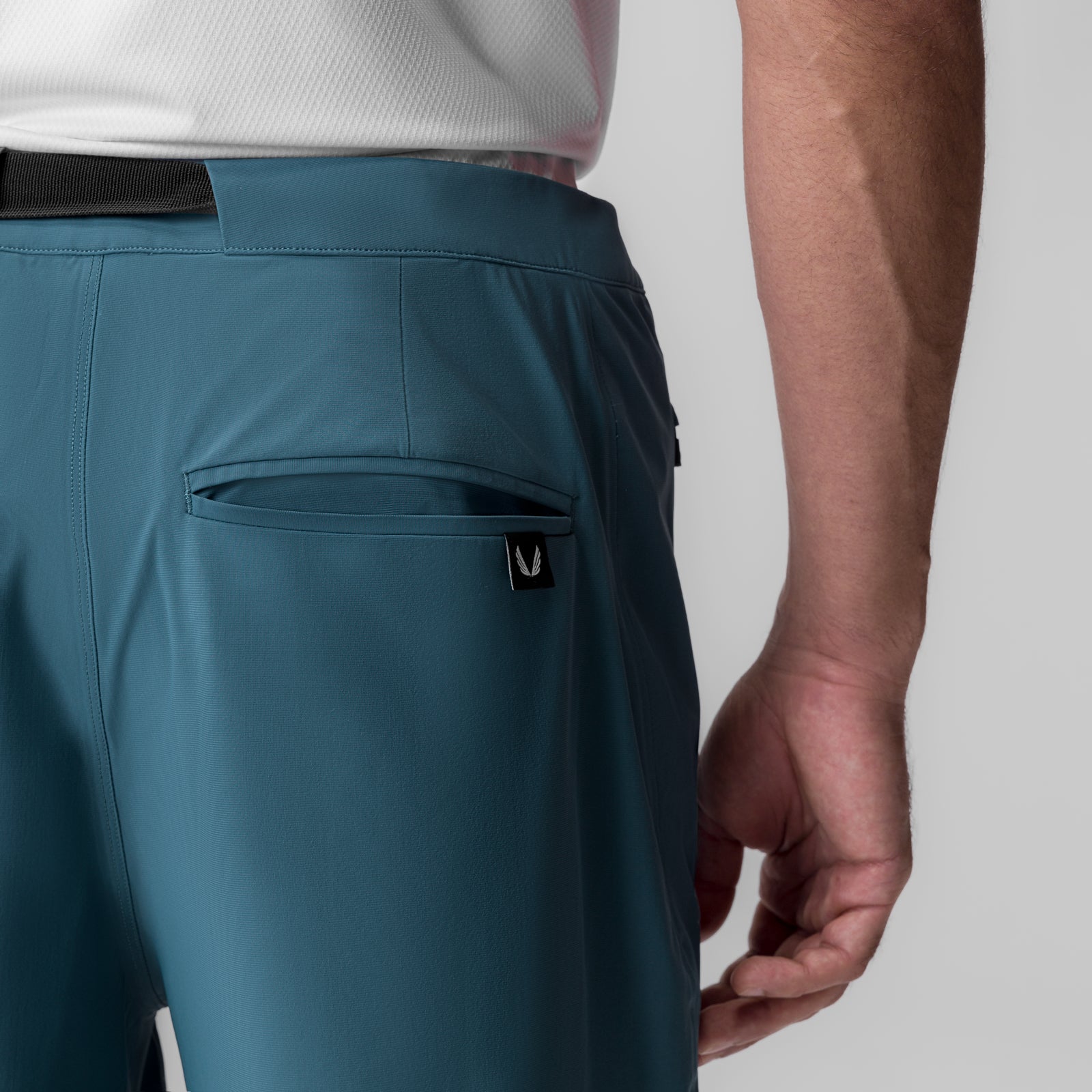 Tetra-Lite Field Pant in storm blue worn by model, back pocket detail view