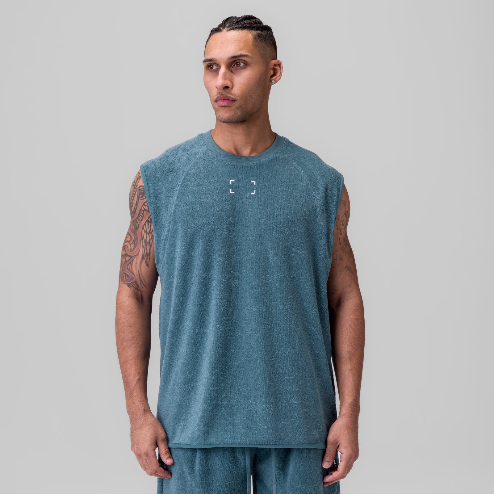 Towel Terry Cutoff sleeveless tank in storm blue, worn by model, front view