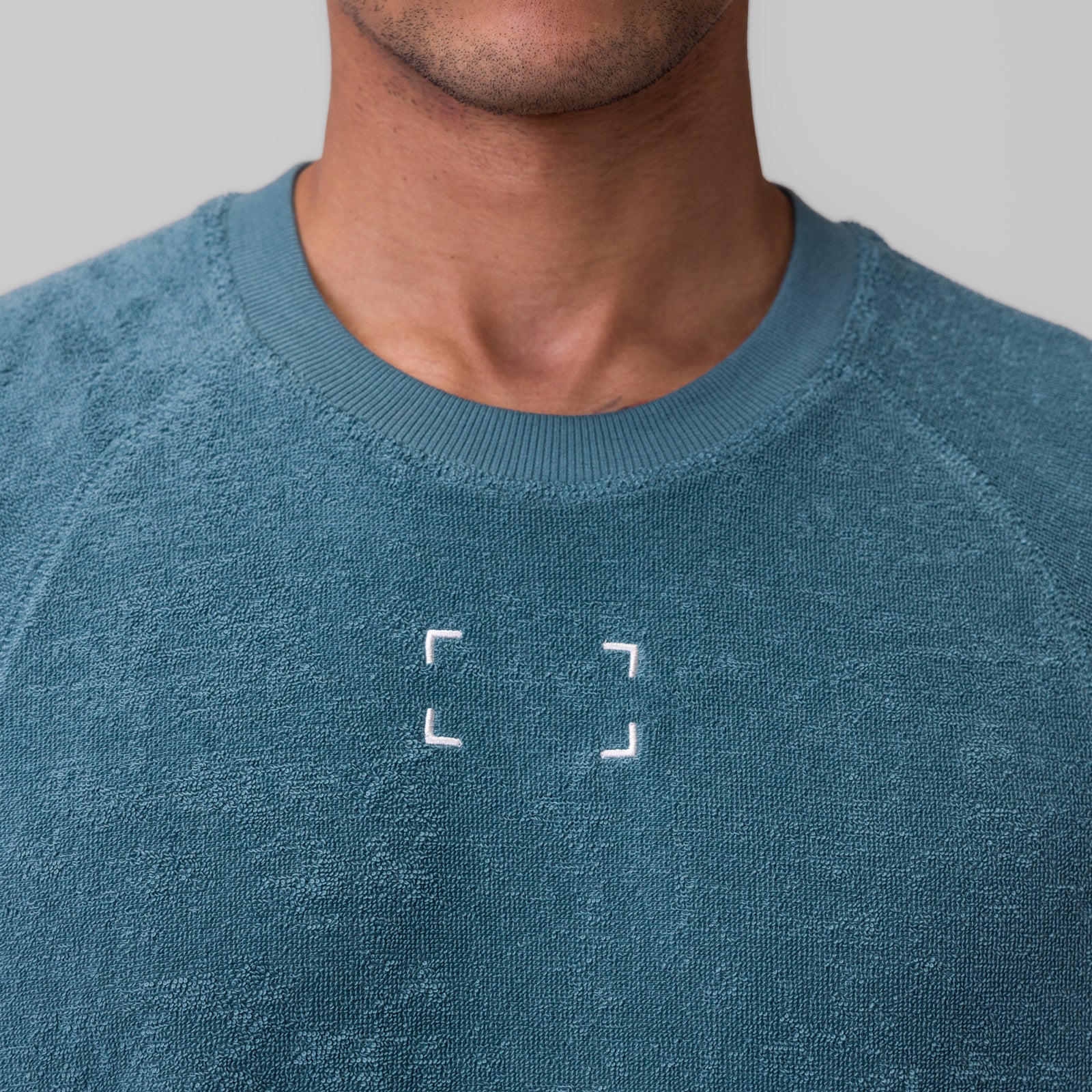 Towel Terry Cutoff sweatshirt in storm blue worn by model, front view