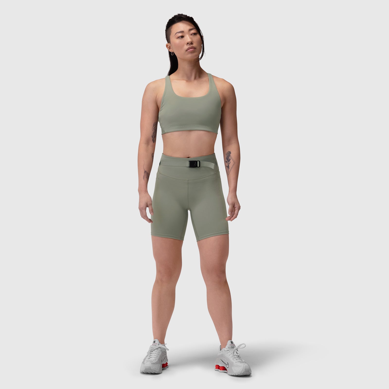 W029 LYCRA® 3-in-1 Biker Short in sage, worn by model standing against white background
