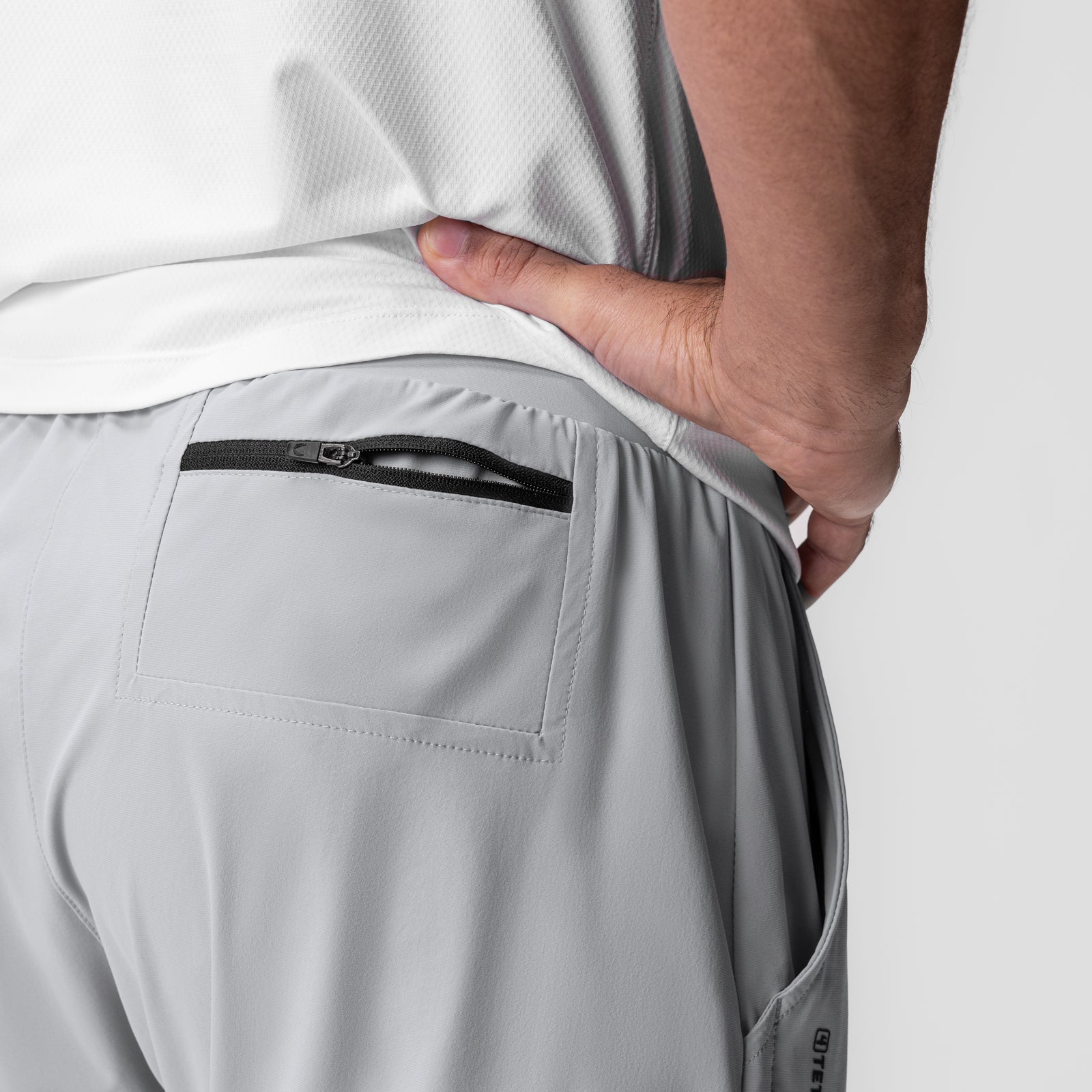 Tetra-Lite 5" Linerless Short in Slate Grey, model wearing shorts with back pocket detail