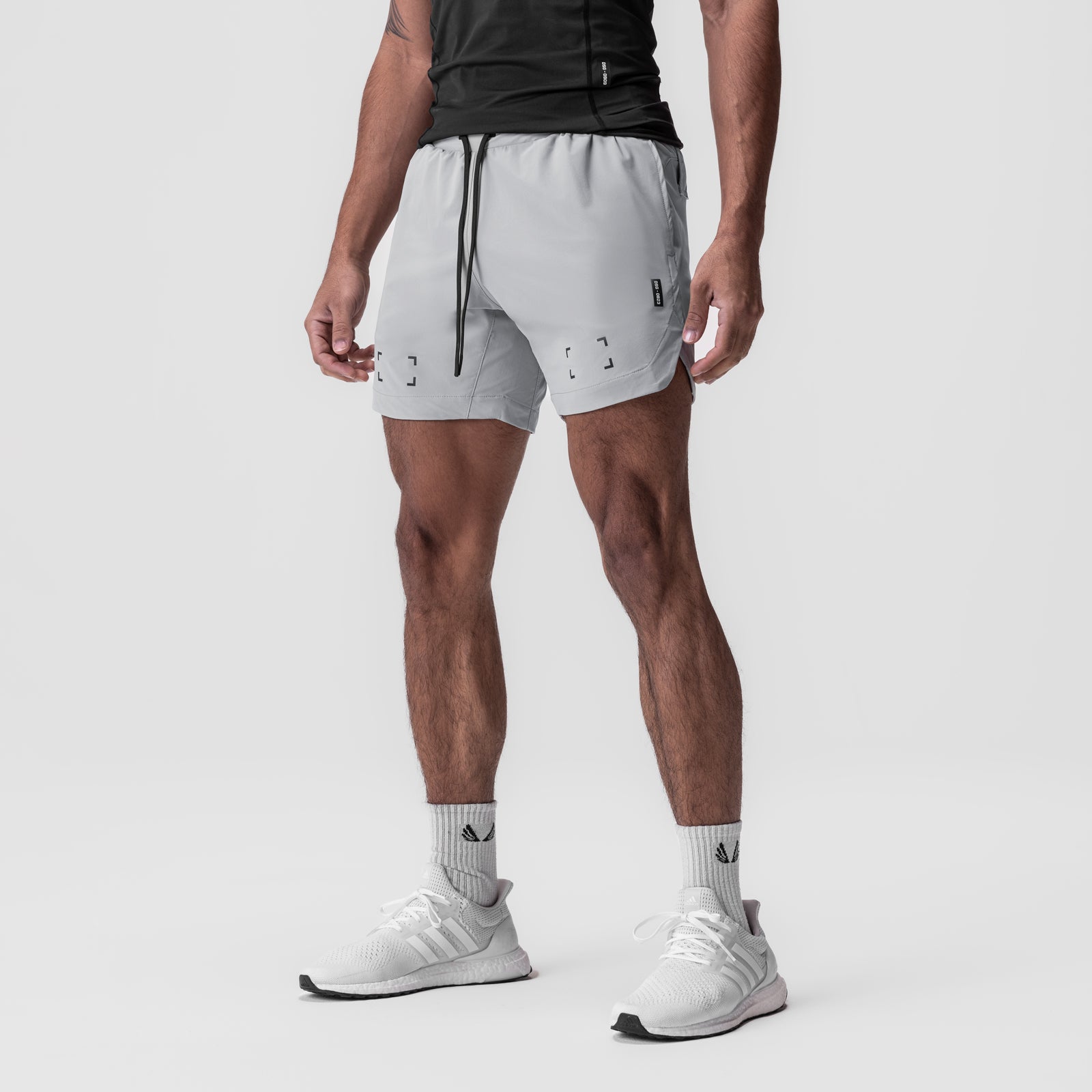 Tetra-Lite 7" Linerless Short in slate grey, worn by model standing in profile