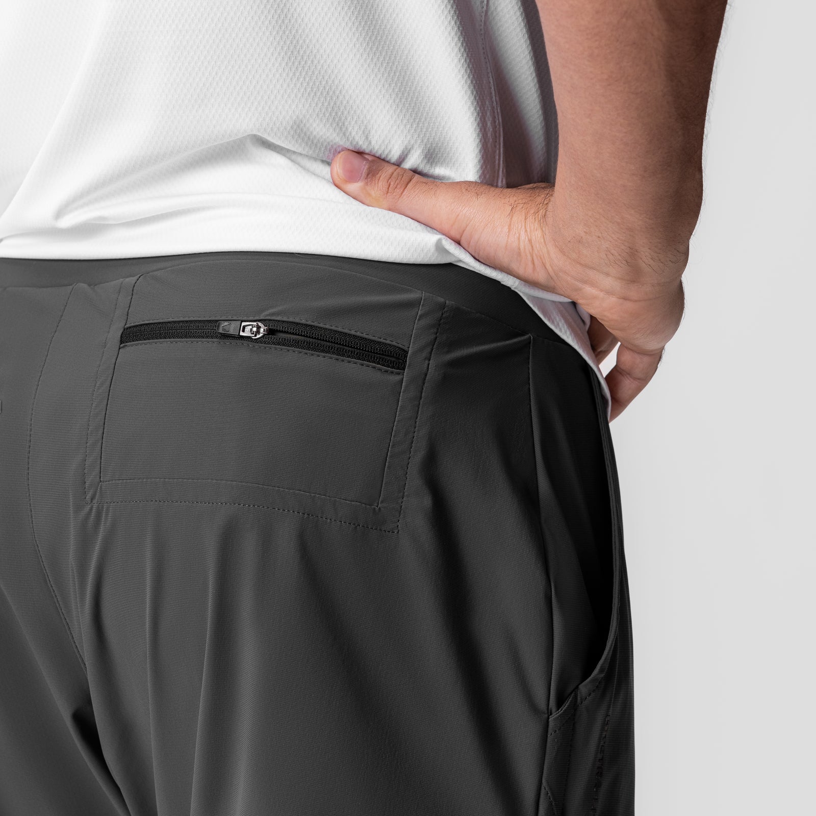 Tetra-Lite 5" Linerless Short in Space Grey, modeled from behind showing back pocket detail