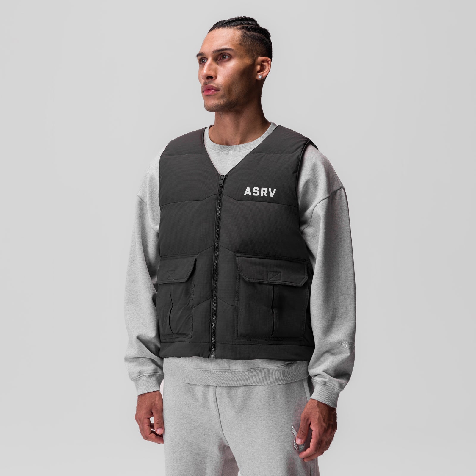 Ripstop Insulated Puffer Gilet in black worn over grey hoodie, front view