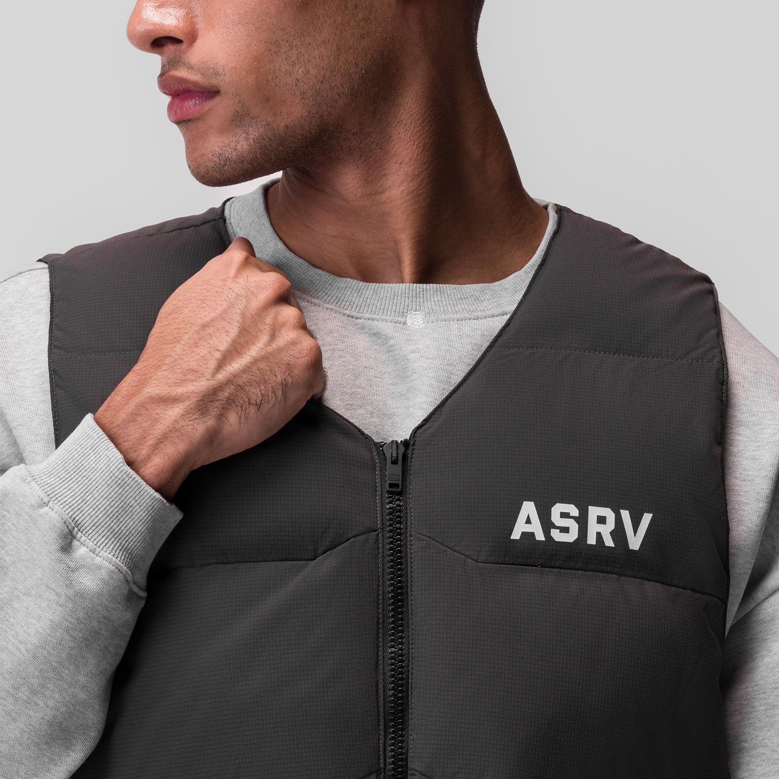 Ripstop Insulated Puffer Gilet in space grey worn over grey long-sleeve shirt, front view