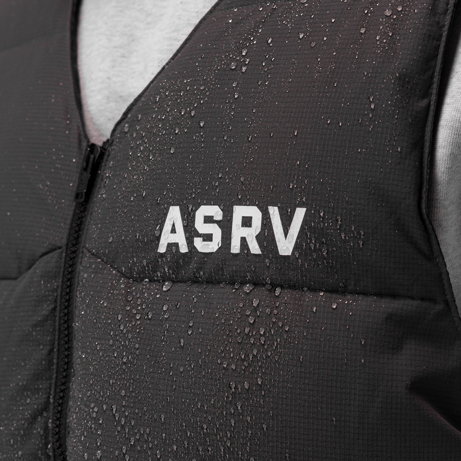 ASRV Ripstop Insulated Puffer Gilet in space grey, worn by model, water-resistant detail