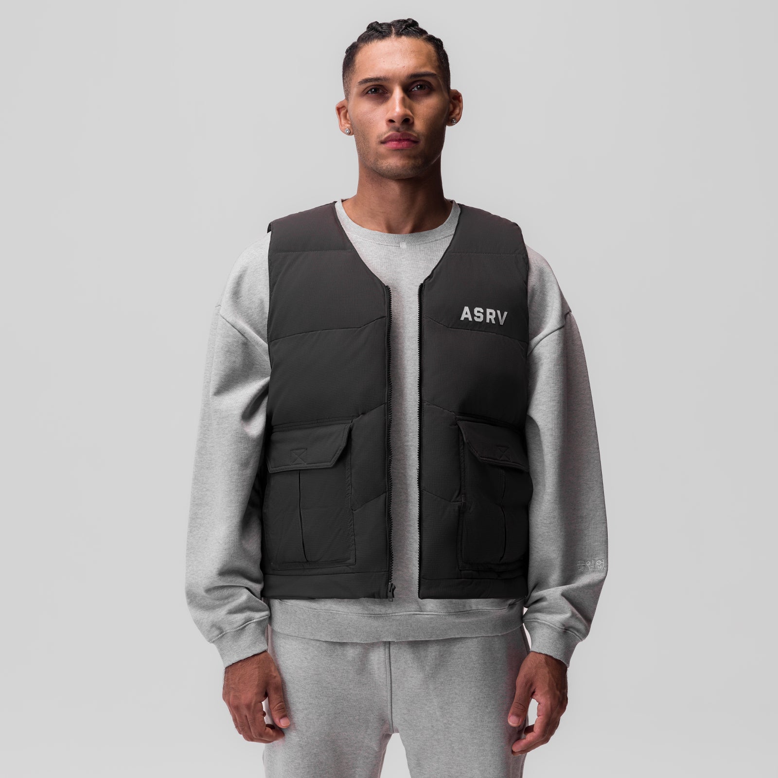 Ripstop Insulated Puffer Gilet in black worn over grey sweatshirt, front view