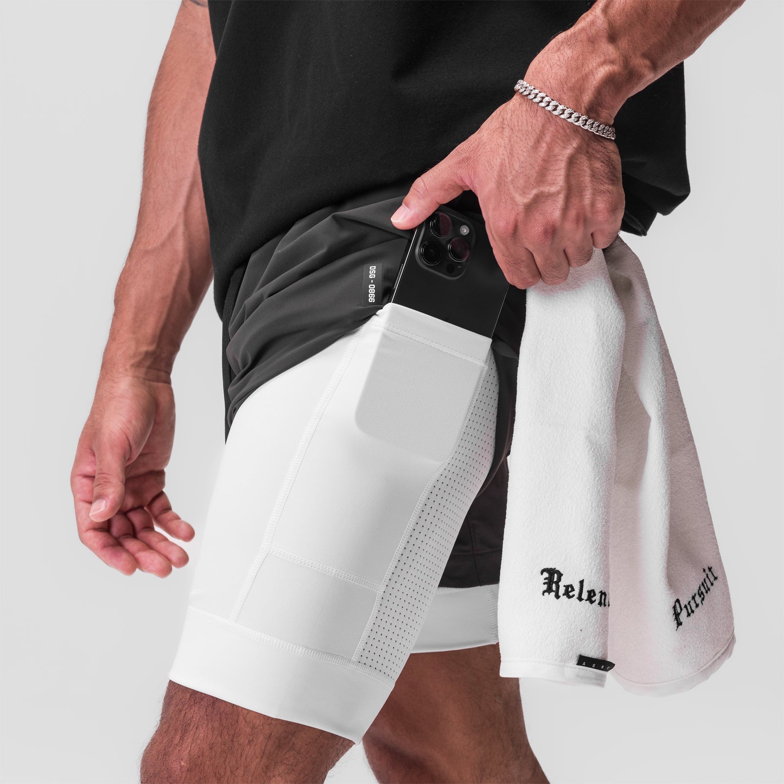 Tetra-Lite 7" Liner Short in Space Grey and White, worn by model holding phone in pocket