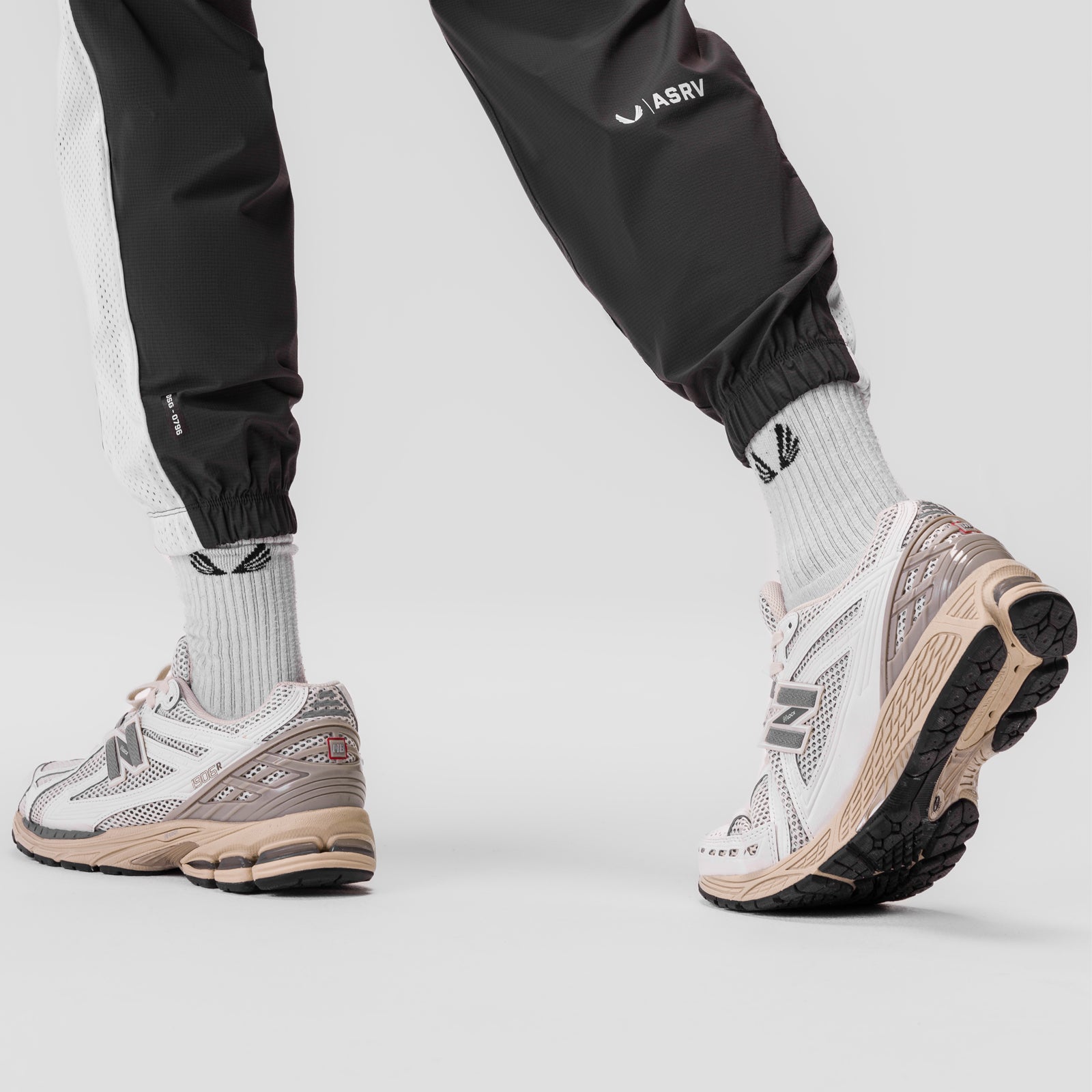Ripstop Oversized Track Pant in Space Grey, worn with white socks and sneakers, front view