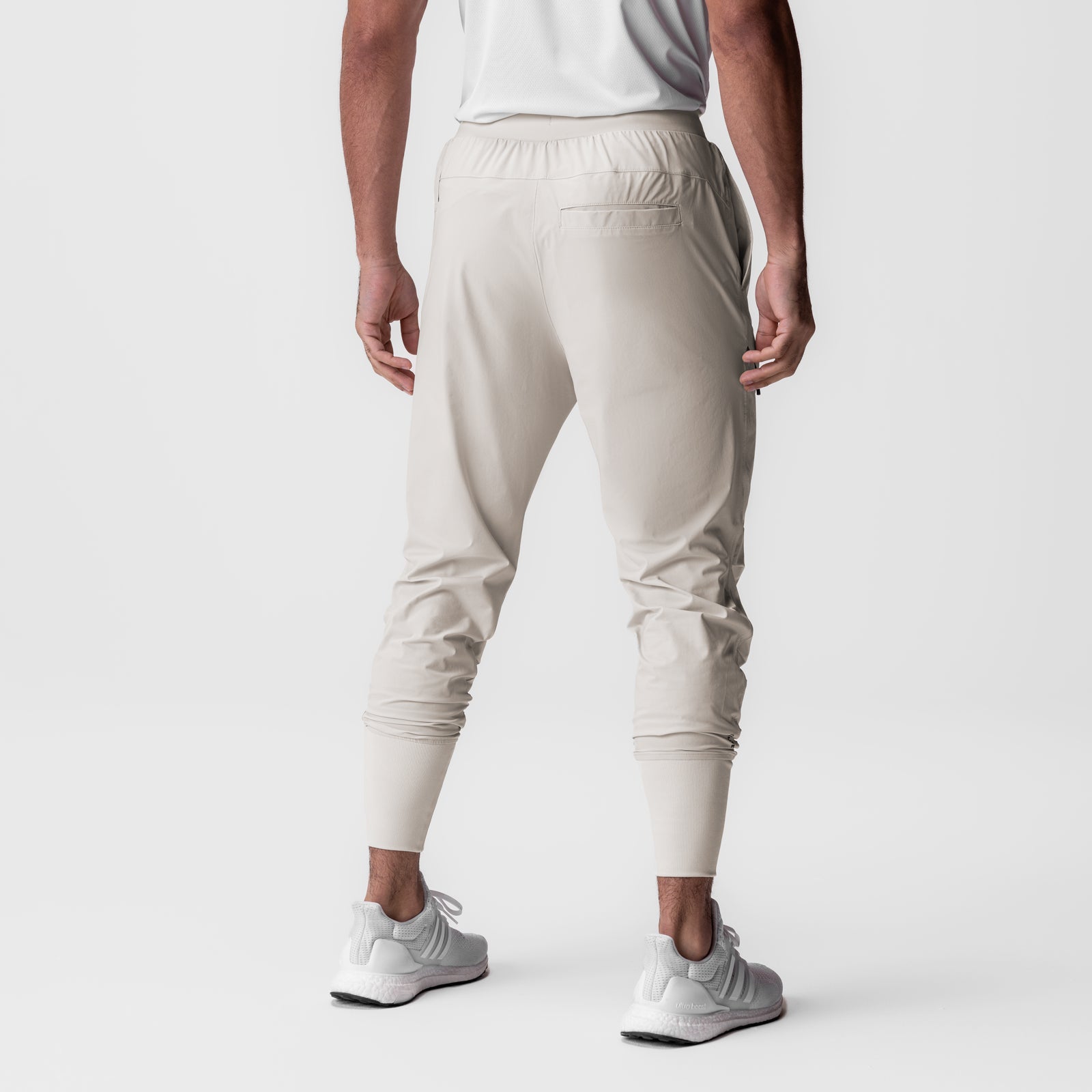 Tetra-Lite Tech High Rib Jogger in stone, rear view on model