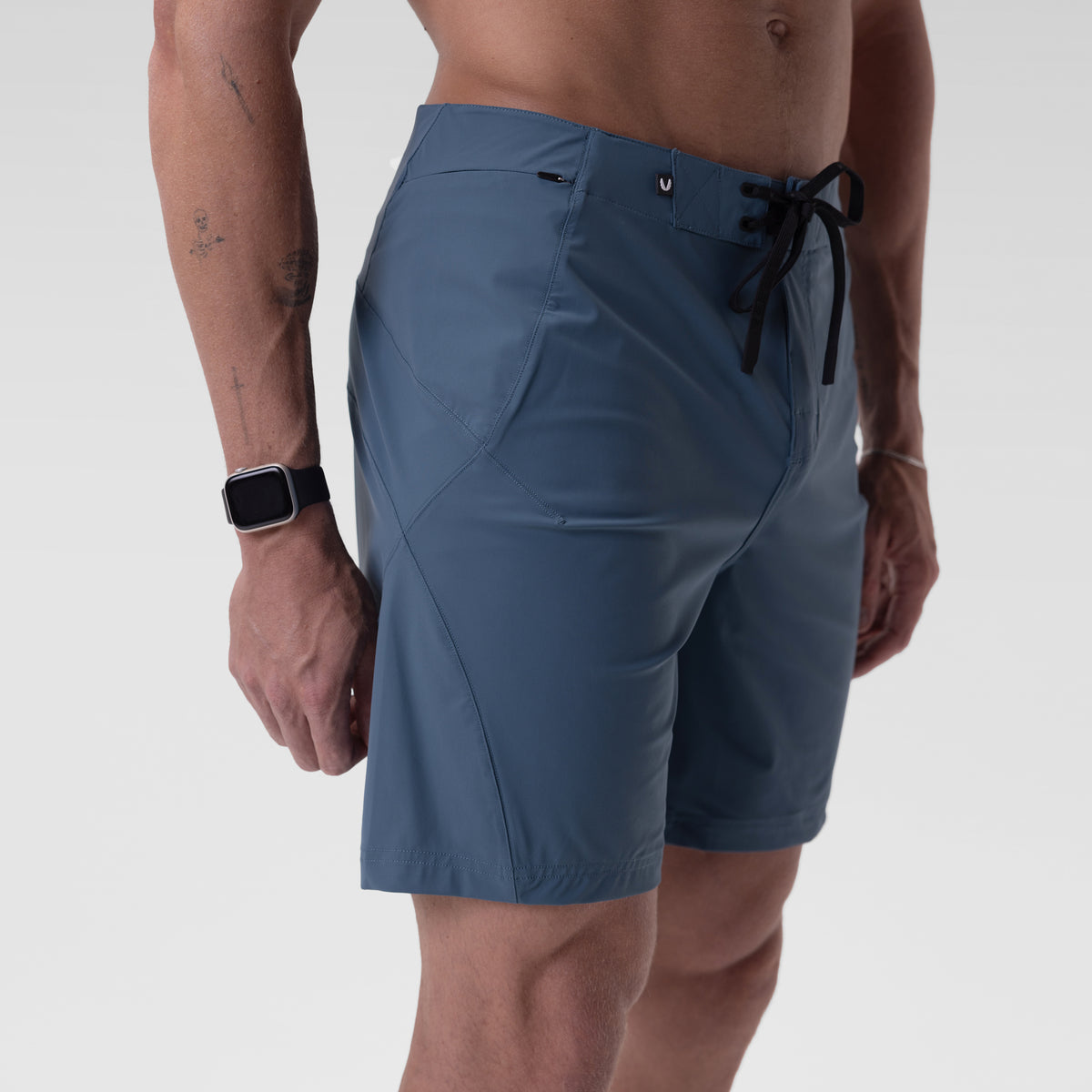 Revolutional Board Short in storm blue, worn by model showing side view