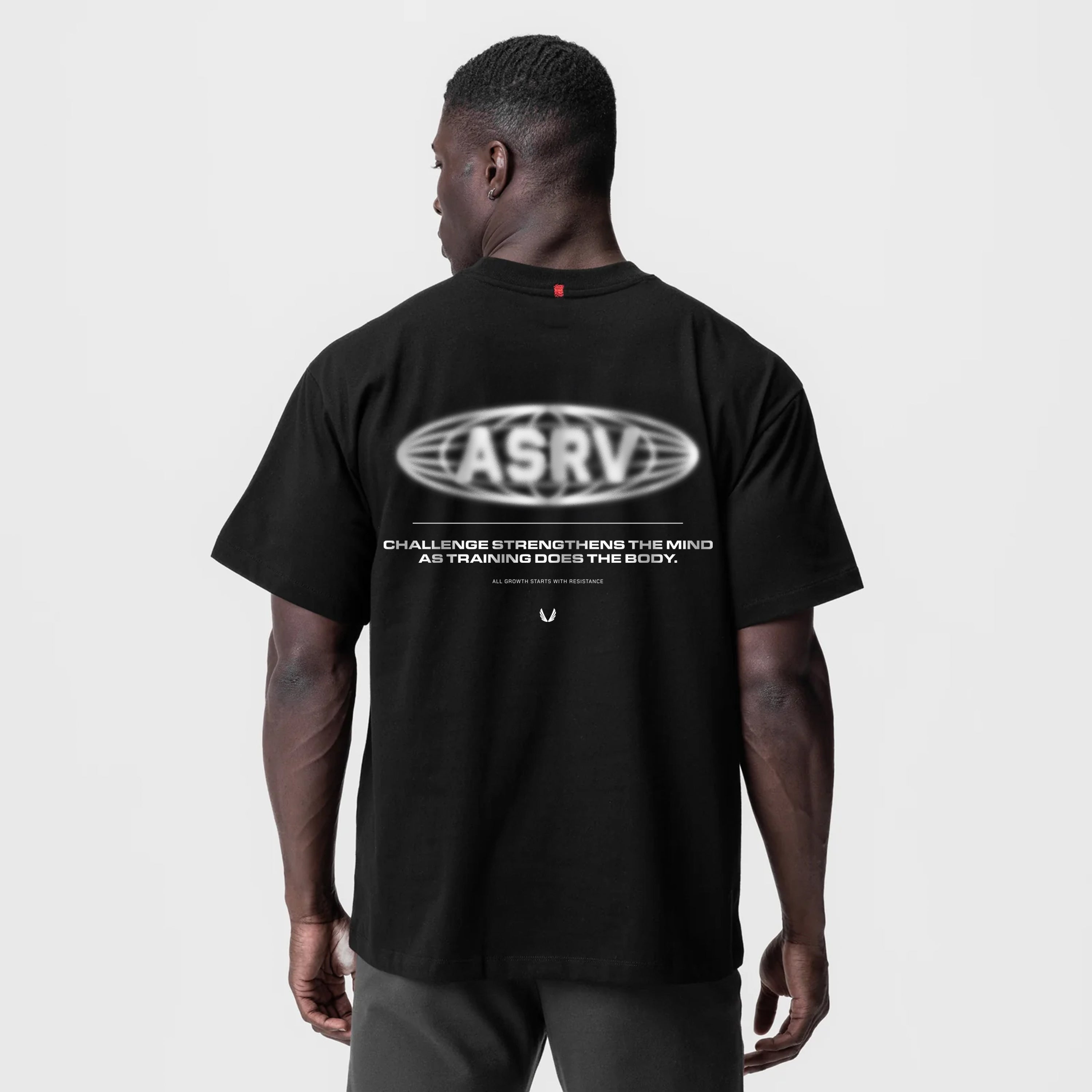 Black Tech Essential Relaxed Tee with ASRV Global Reach print, worn by model, back view