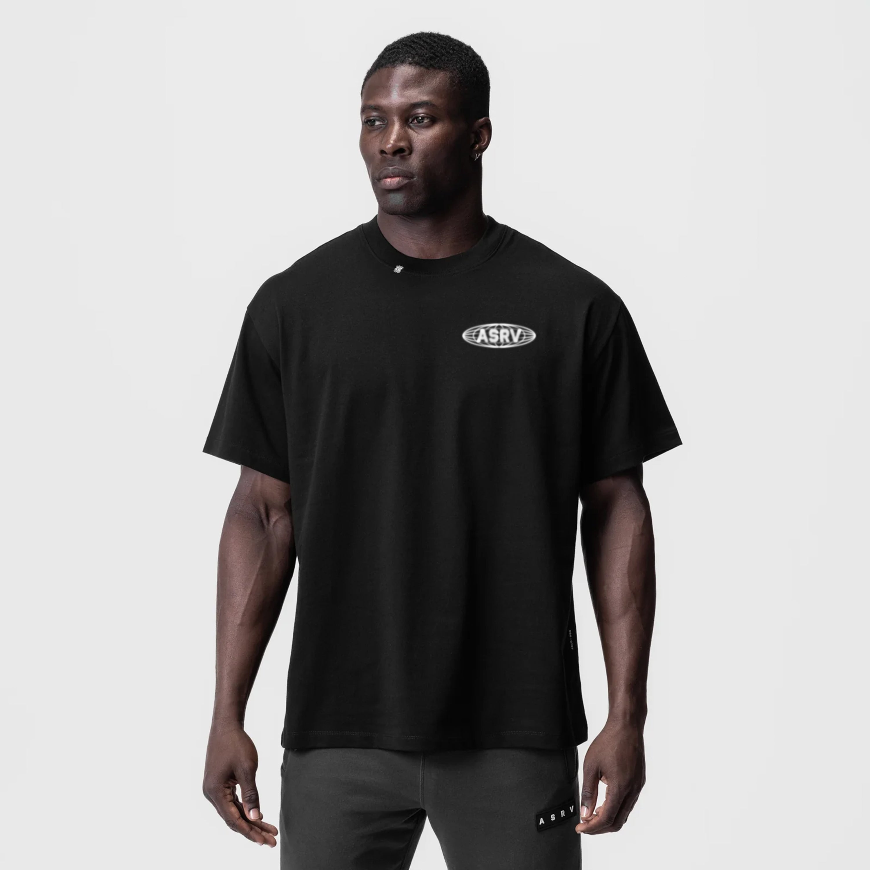 Black Tech Essential Relaxed Tee worn by model, front view with ASRV logo