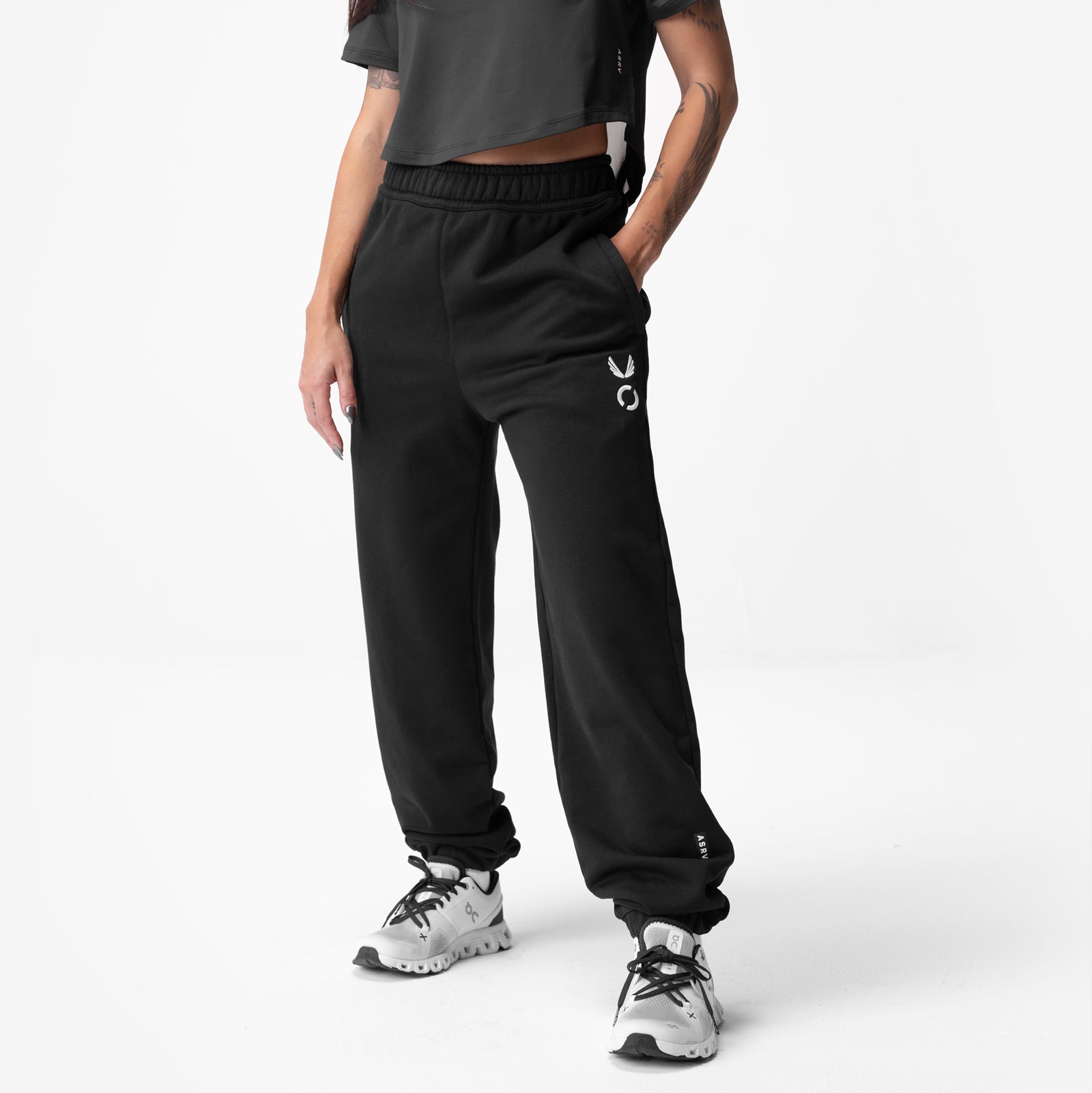 Black ASRV Sorona French-Terry oversized jogger worn with white sneakers, front view
